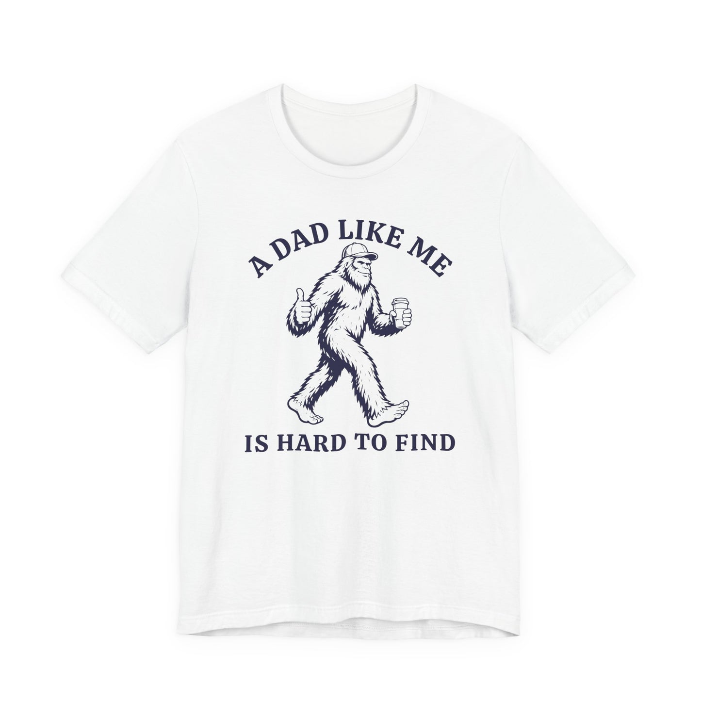 Bella + Canvas 3001 t-shirt in white featuring a funny Bigfoot dad design with a Sasquatch holding a coffee cup and giving a thumbs up alongside the phrase “A Dad Like Me Is Hard To Find” in navy blue lettering.