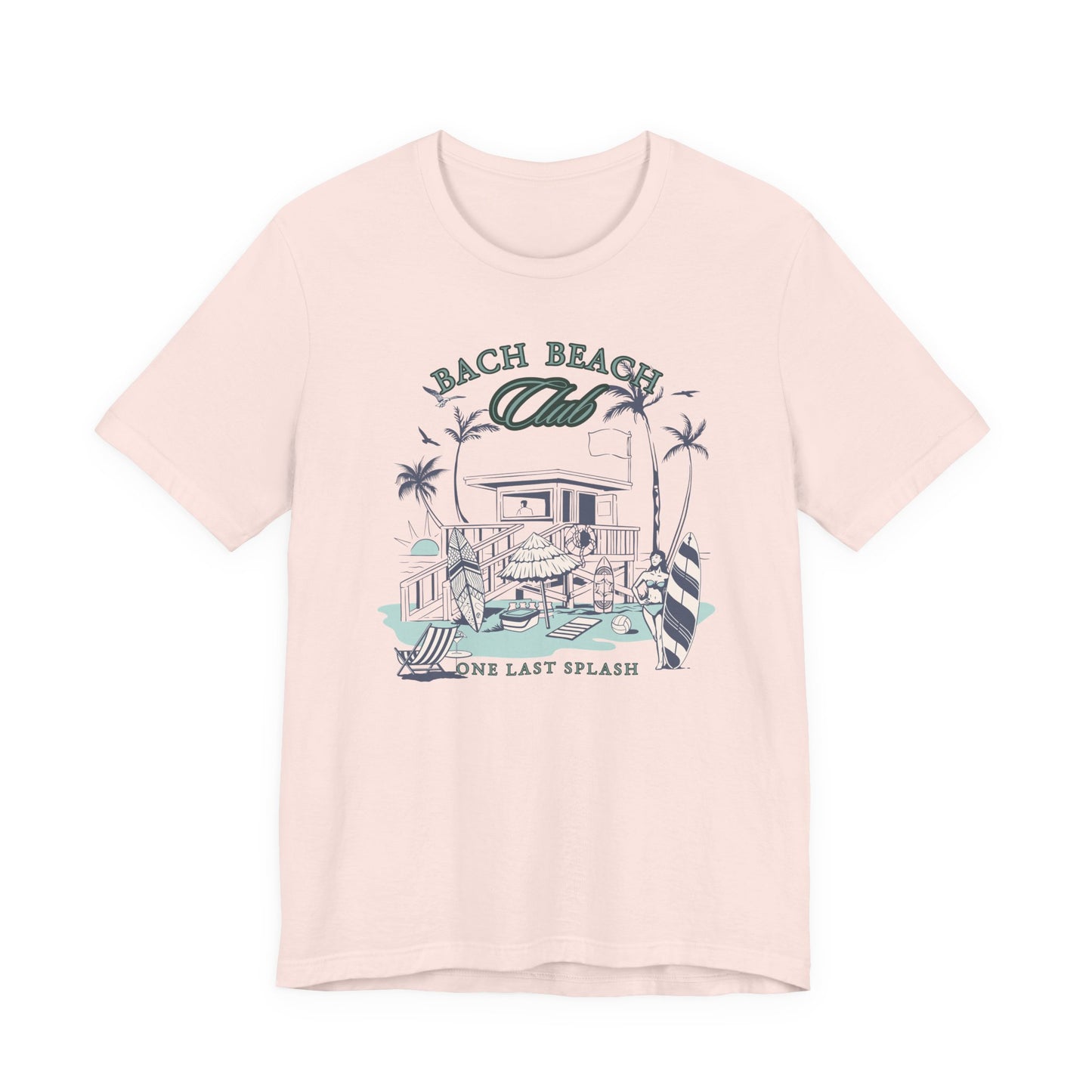 Bella + Canvas 3001 t-shirt in light pink featuring a retro beach bachelor party design with palm trees, surfboards, beach house artwork, and “Bach Beach Club, One Last Splash” wording in coastal green and blue lettering.