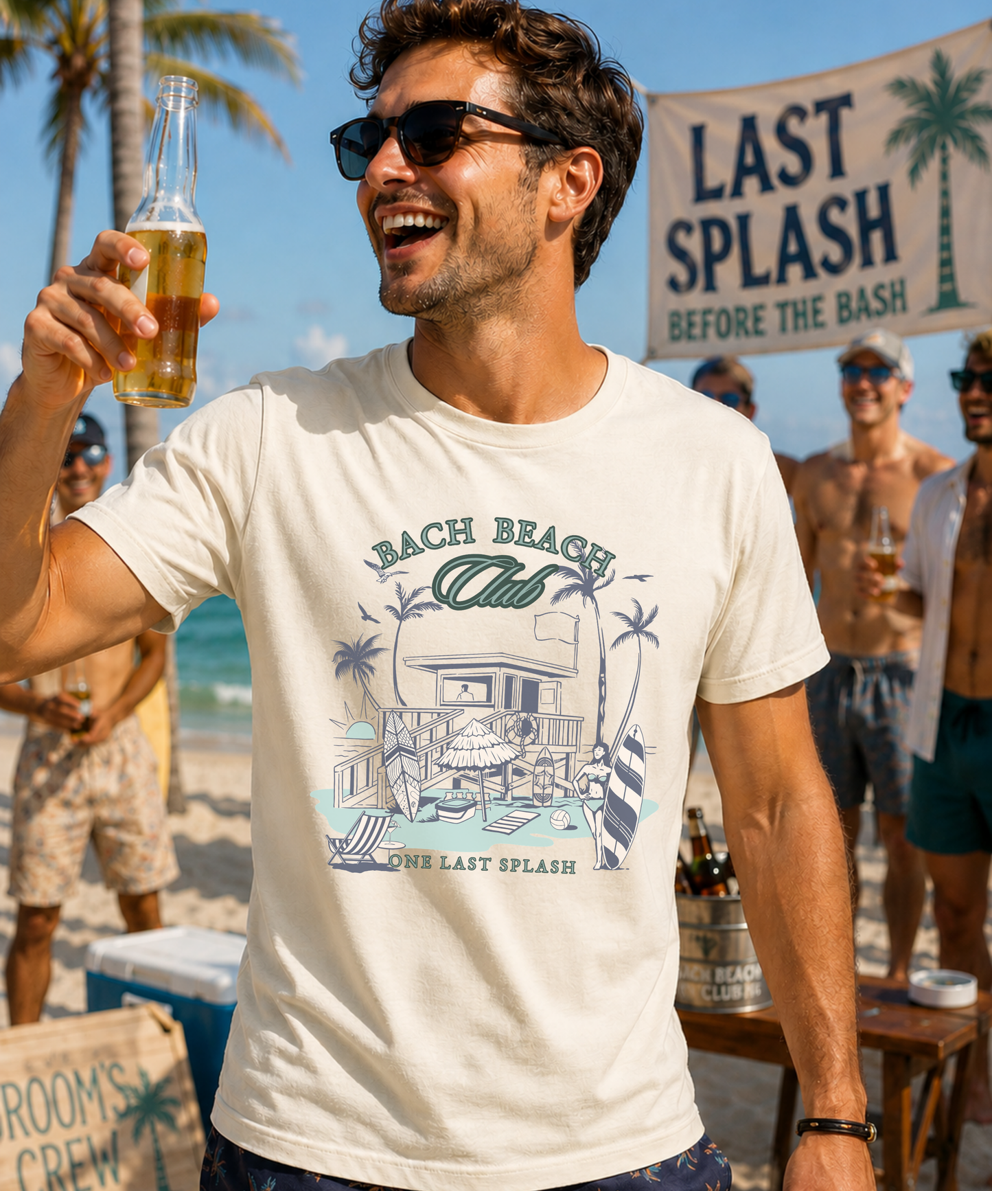 Man wearing a Bella + Canvas 3001 t-shirt in natural featuring a retro beach bachelor party design with palm trees, surfboards, beach house artwork, and “Bach Beach Club, One Last Splash” wording during a tropical beach bash.