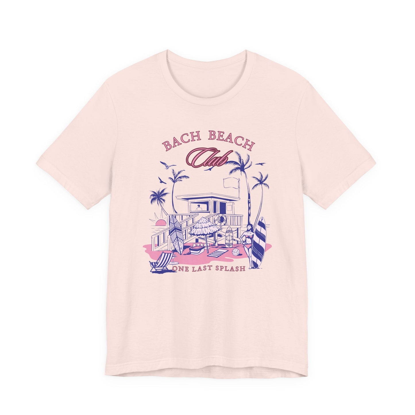 Bella + Canvas 3001 t-shirt in soft pink featuring a retro beach bachelorette design with palm trees, surfboards, beach house artwork, and “Bach Beach Club, One Last Splash” wording in pink and blue tropical lettering.