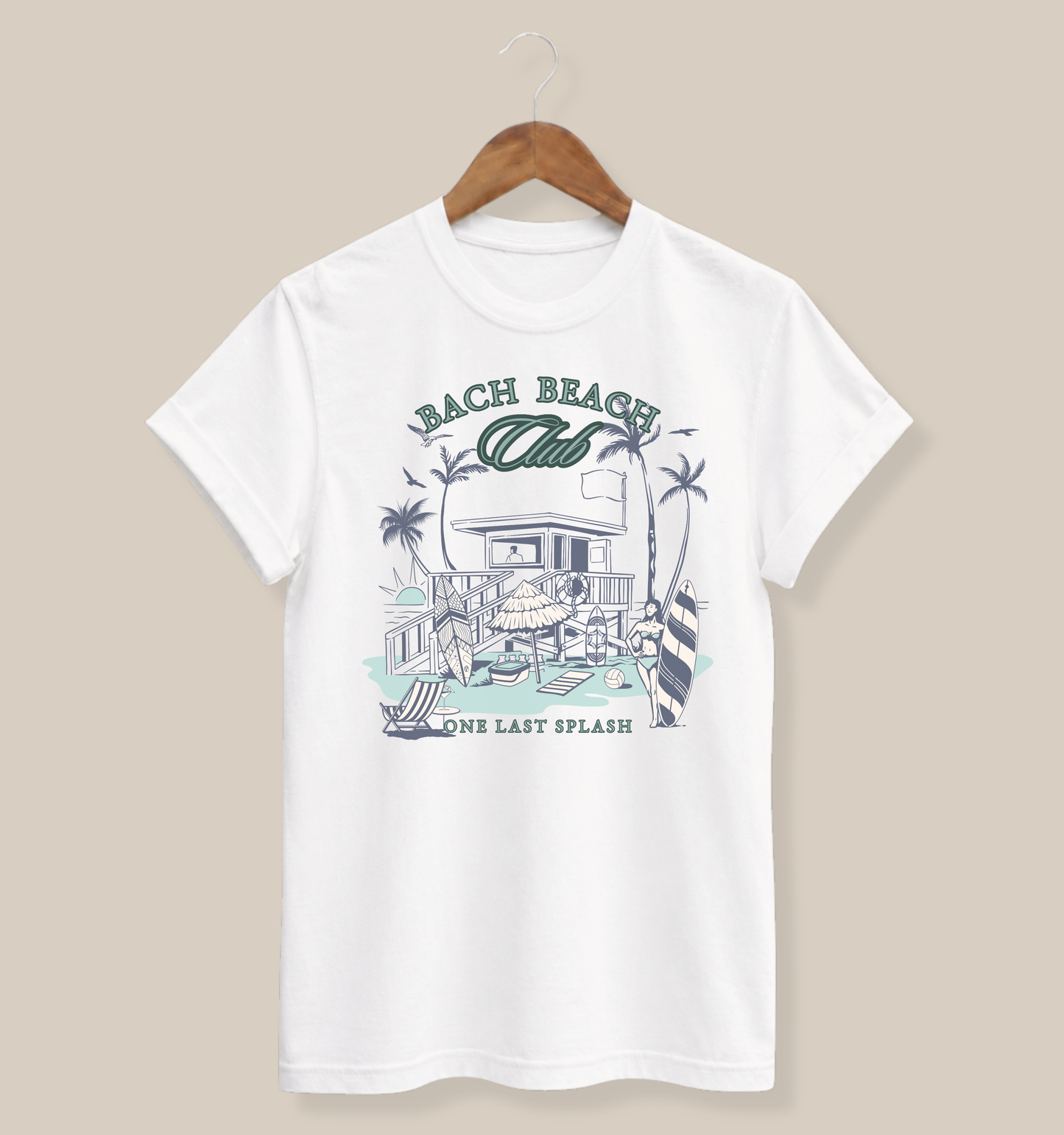 Bella + Canvas 3001 t-shirt in white featuring a retro beach bachelorette design with palm trees, surfboards, beach house artwork, and “Bach Beach Club, One Last Splash” wording in green and blue coastal-inspired lettering.