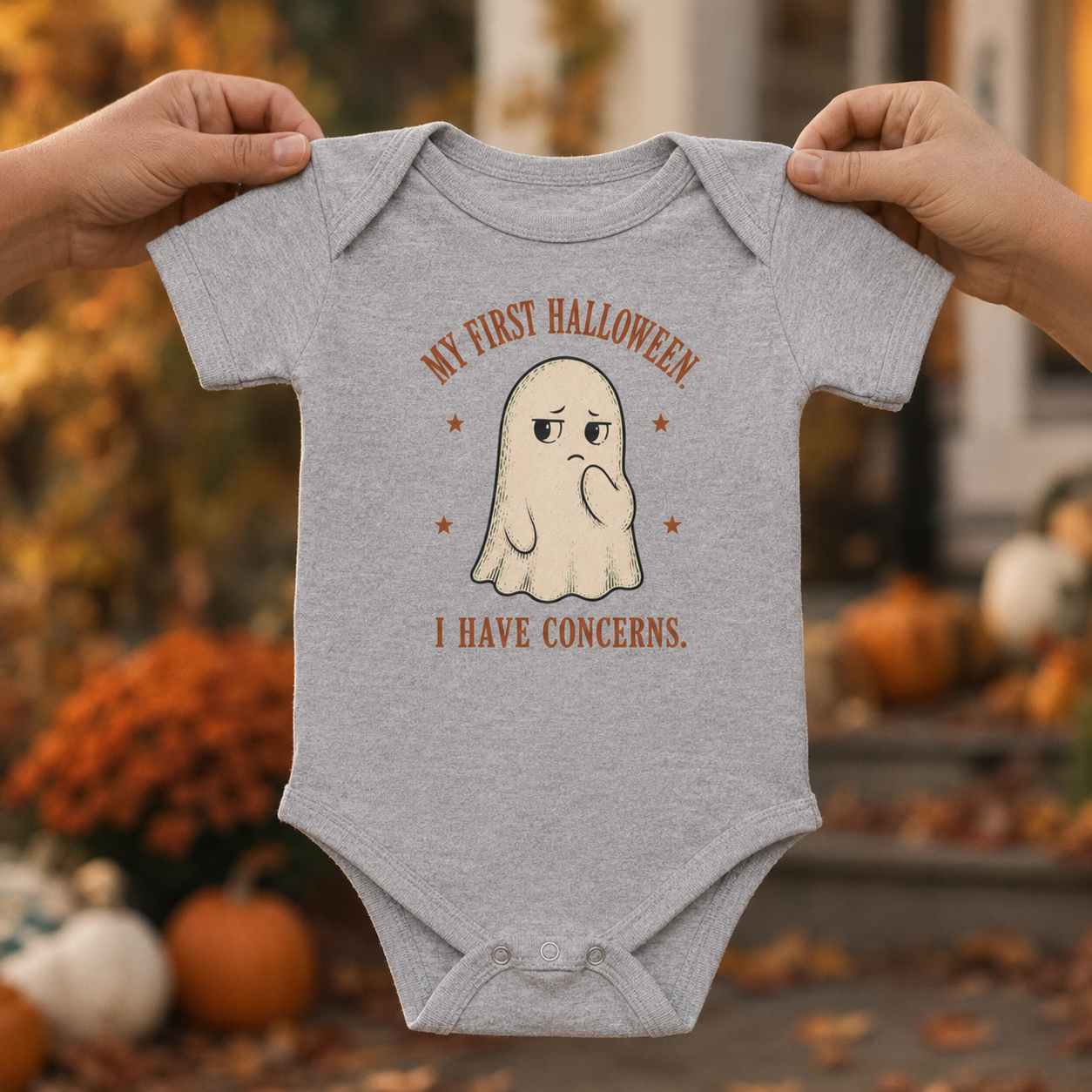 Bella + Canvas 100B infant bodysuit in Athletic Heather Grey featuring a vintage-style ghost with the funny phrase "My First Halloween, I Have Concerns." A playful baby's first Halloween one-piece perfect for fall festivities, pumpkin patch visits, Halloween photos, and seasonal baby outfits.