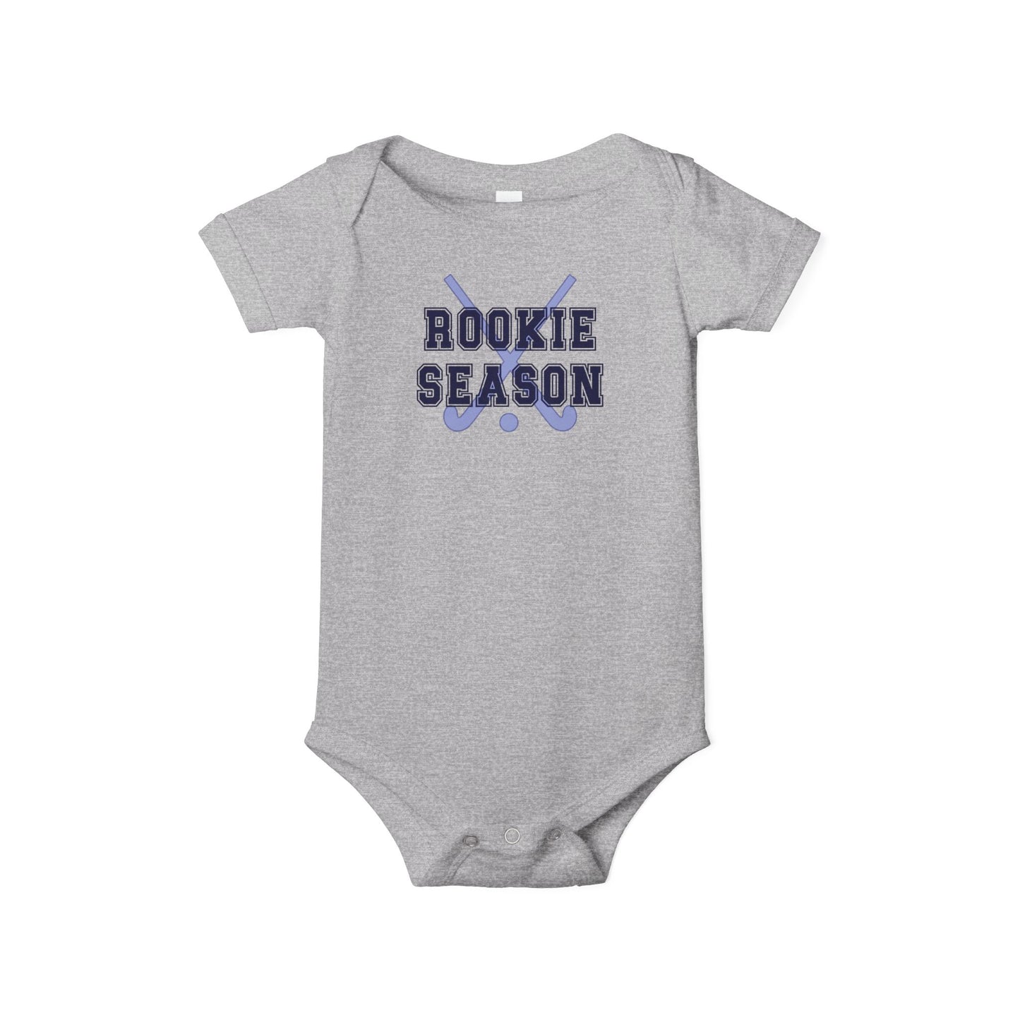 Bella + Canvas 100B athletic heather infant bodysuit featuring crossed field hockey sticks and "Rookie Season" text. Heather gray baby one-piece for field hockey families, newborn gifts, baby showers, game day outfits, and celebrating a baby's first field hockey season.
