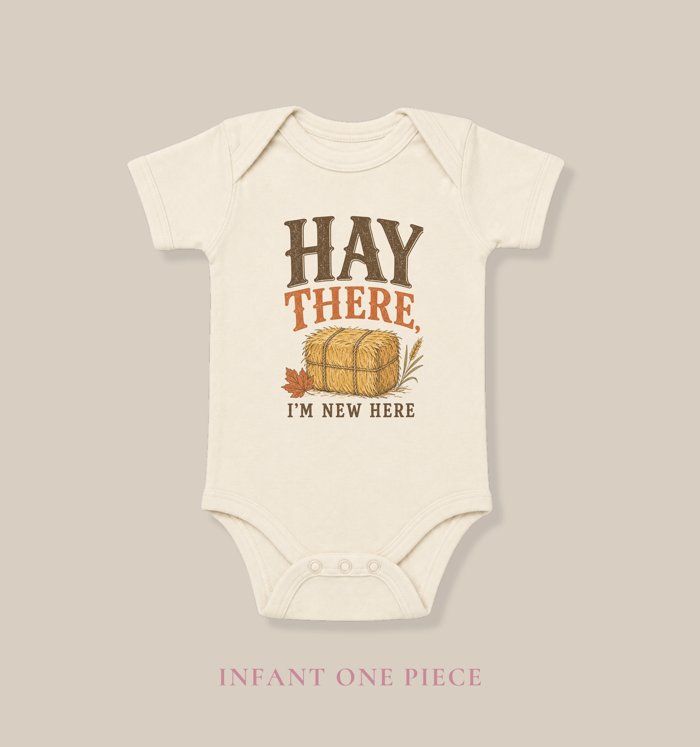 Natural Bella + Canvas 100B infant one piece featuring the phrase "Hay There, I'm New Here" with a hay bale illustration and autumn accents. Adorable fall baby bodysuit for newborns and infants, perfect for baby's first fall, pumpkin patch visits, hayrides, baby showers, autumn photo sessions, and seasonal family outings.