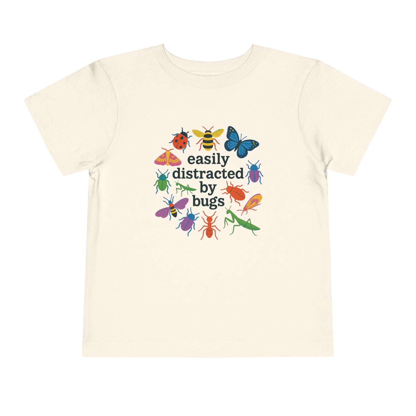 Bella + Canvas 3001T toddler t-shirt in natural featuring colorful butterflies, bees, beetles, ladybugs, and praying mantises surrounding the phrase “Easily Distracted by Bugs.” Fun nature-inspired shirt for toddlers who love insects, outdoor exploration, science, gardening, and discovering bugs in the backyard.