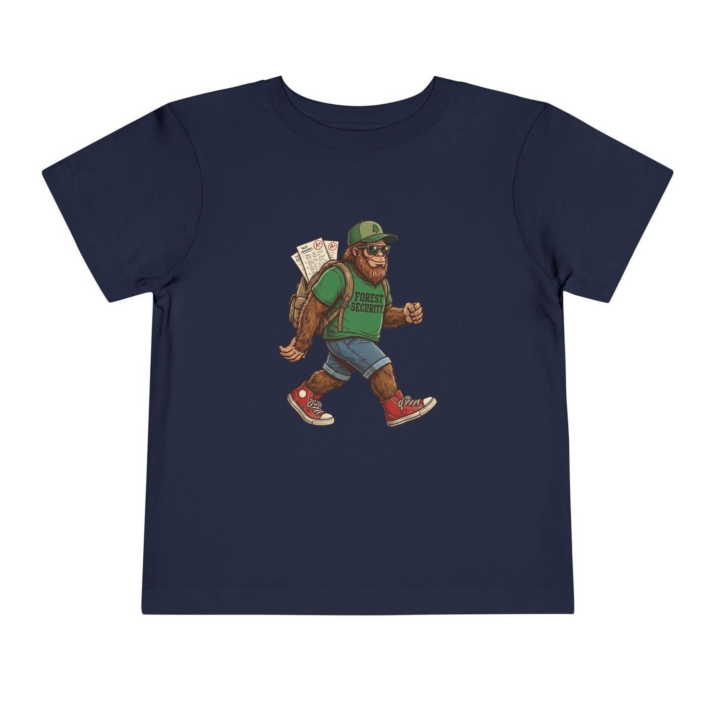 Bella + Canvas 3001T toddler t-shirt in navy featuring a walking Bigfoot student graphic wearing sunglasses, a green Forest Security shirt, backpack with school papers, denim shorts, and red sneakers. Playful back-to-school toddler shirt design for young Bigfoot fans.
