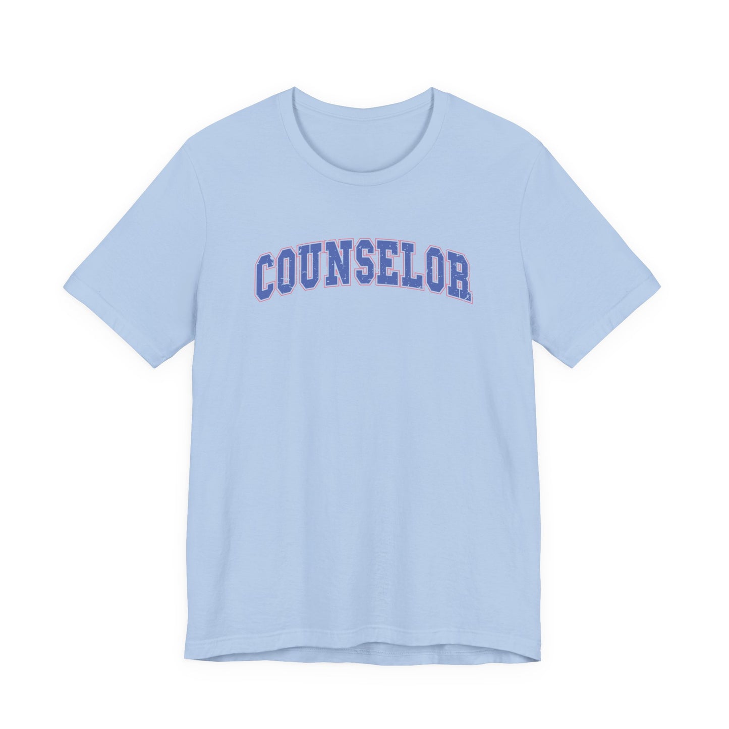 Bella + Canvas 3001 unisex t-shirt in Baby Blue featuring a vintage varsity-style "Counselor" graphic in blue with a pink outline. A soft and comfortable counselor appreciation shirt for school counselors, guidance counselors, and student support staff.