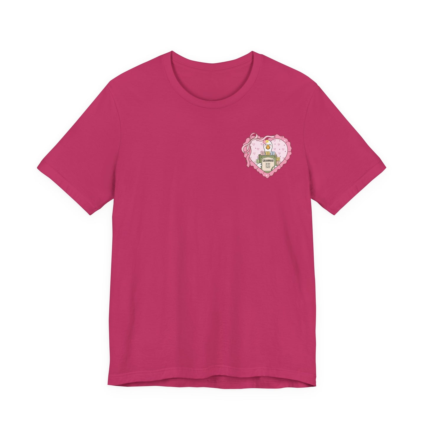 Bella + Canvas 3001 t-shirt in Berry featuring a coquette English teacher goose heart pocket design with a grammar book, pink heart frame, ribbon bow, and classroom-inspired details. Cute teacher gift shirt for English and language arts educators.