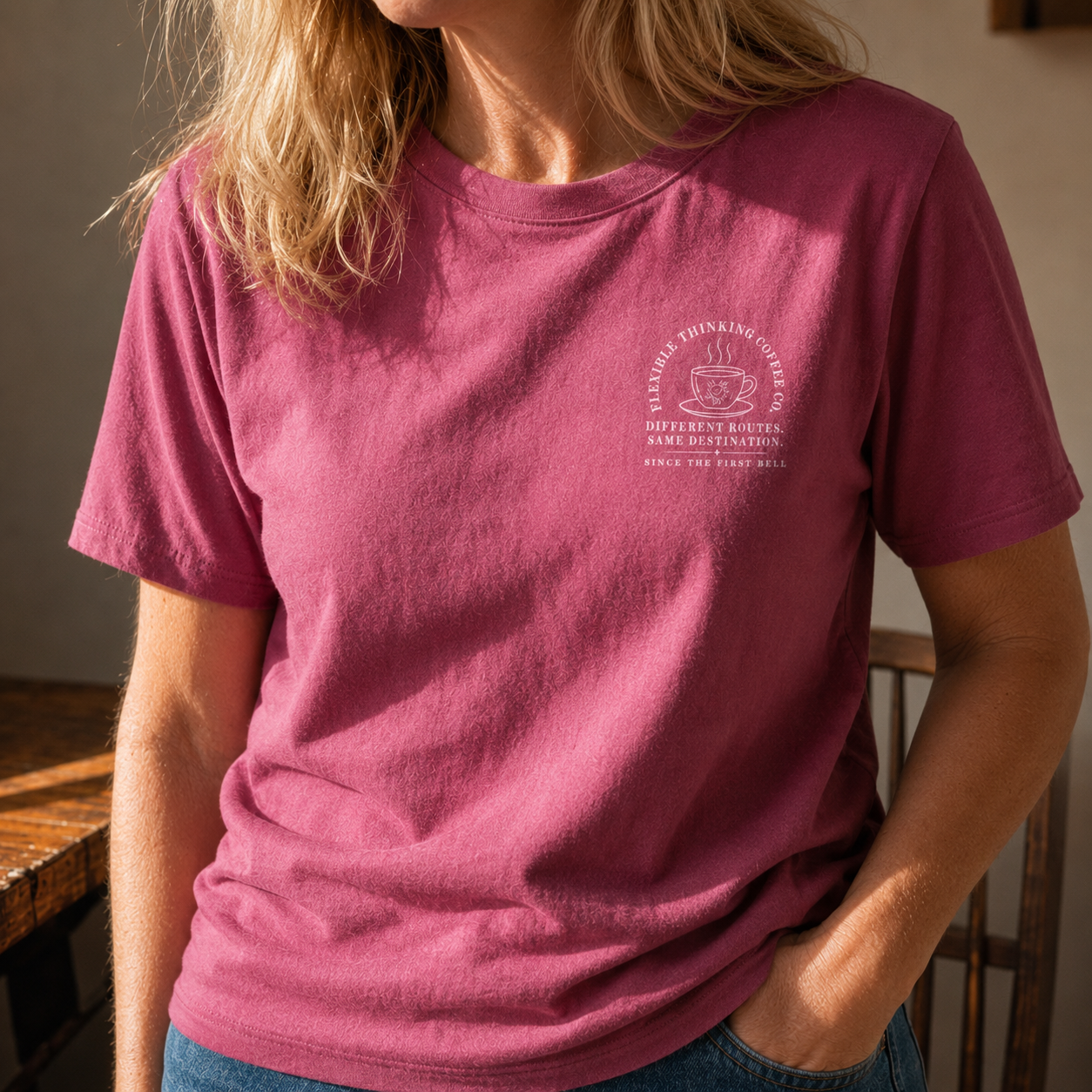 Bella + Canvas 3001 unisex t-shirt in Berry featuring a small left chest "Flexible Thinking Coffee Co." graphic with a coffee cup and the phrase "Different Routes. Same Destination. Since the First Bell." Comfortable teacher graphic tee for special education teachers, educators, school staff, and everyday classroom wear.