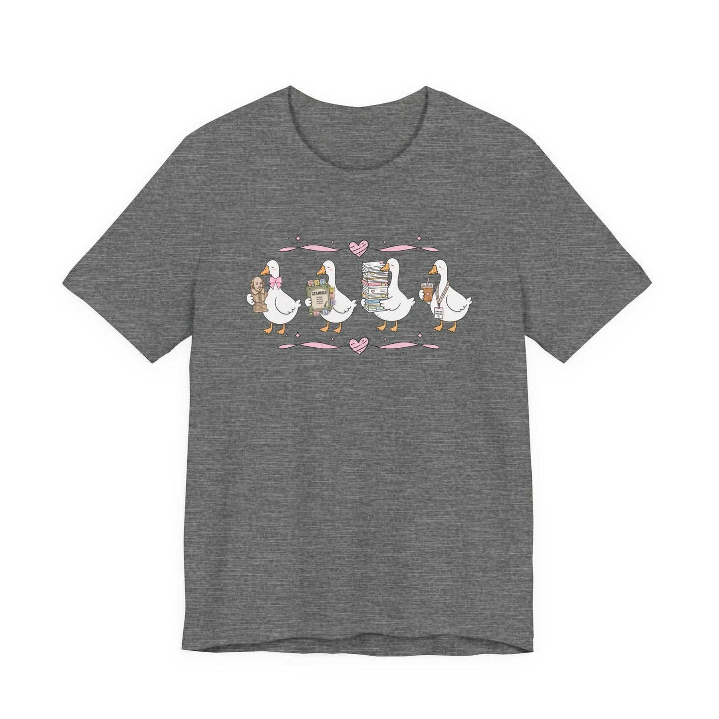 Bella + Canvas 3001 t-shirt in Deep Heather featuring a coquette English teacher goose design. Four white geese carry a classic literature bust, a grammar book, a stack of books and papers, and an iced coffee with an English teacher lanyard. Pink hearts and ribbon accents add a whimsical touch, making this cute English teacher shirt perfect for back-to-school outfits, teacher appreciation gifts, and everyday classroom wear.