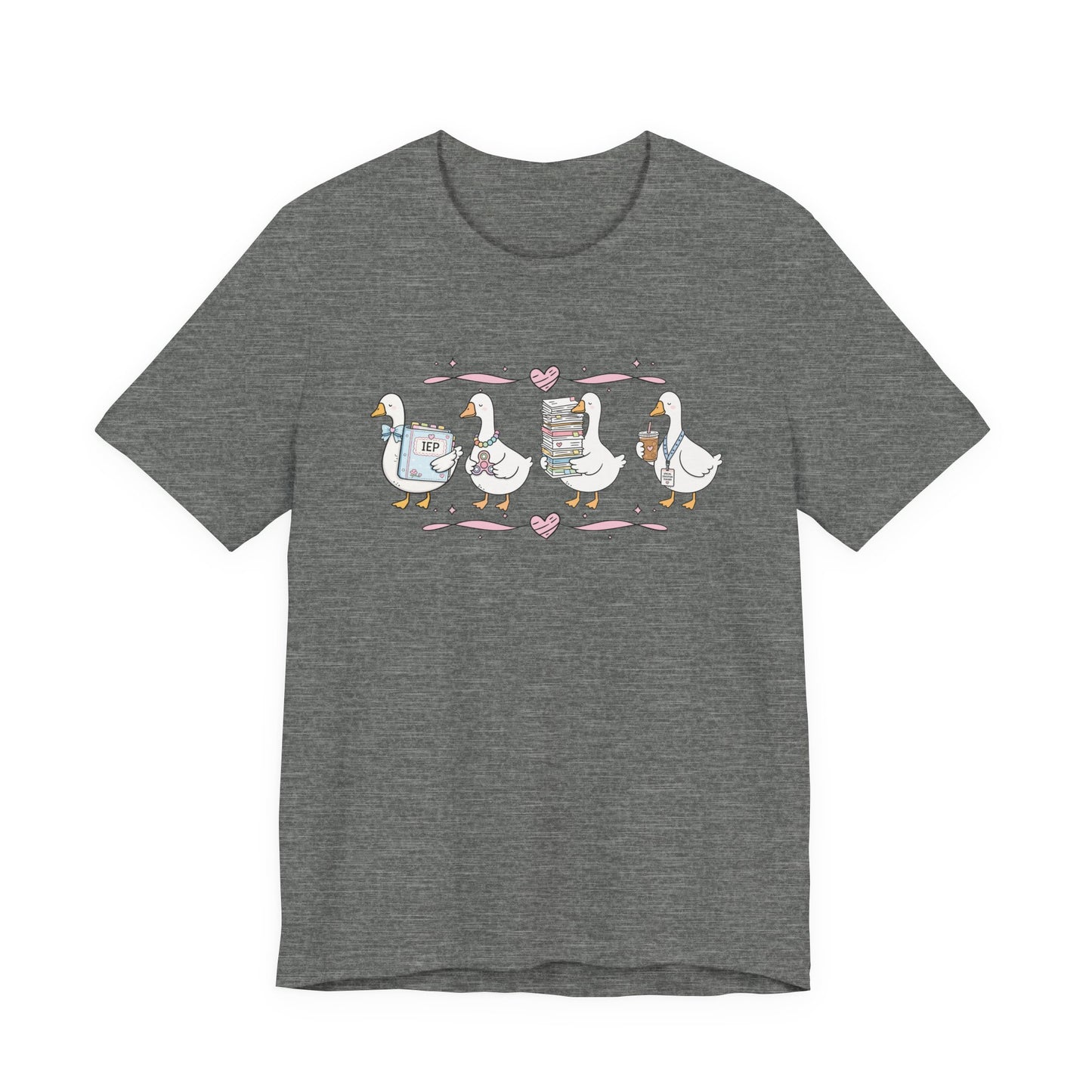 Bella + Canvas 3001 t-shirt in Deep Heather featuring a coquette special education teacher goose design. Four white geese hold an IEP binder, sensory fidget toy, stack of paperwork, and iced coffee with a special education teacher lanyard. Pink hearts and ribbon accents add a charming touch. This cute SPED teacher shirt is perfect for special education teachers, paraprofessionals, IEP case managers, back-to-school outfits, teacher appreciation gifts, and everyday classroom wear.