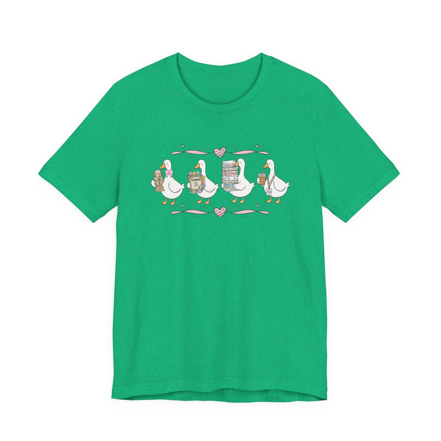 Bella + Canvas 3001 t-shirt in Heather Kelly featuring a coquette English teacher goose design. Four white geese carry a classic literature bust, a grammar book, a stack of books and papers, and an iced coffee with an English teacher lanyard. Pink hearts and ribbon accents create a charming classroom-inspired look, making this shirt perfect for English teachers, teacher appreciation gifts, and back-to-school outfits.