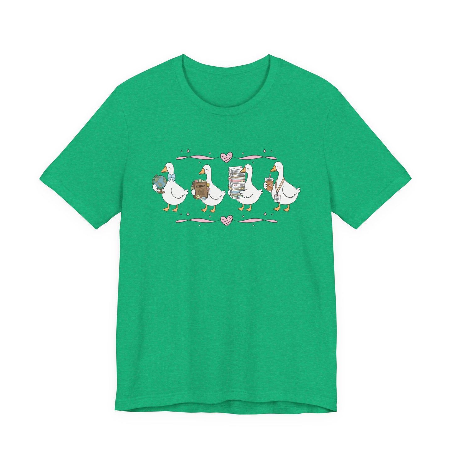 Bella + Canvas 3001 t-shirt in Heather Kelly featuring a coquette history teacher goose design. Four white geese carry a globe, history textbook, stack of classroom papers, and iced coffee with a history teacher lanyard. Pink hearts and ribbon accents add a playful touch to this cute history teacher shirt, perfect for classroom wear, teacher appreciation gifts, and back-to-school outfits.