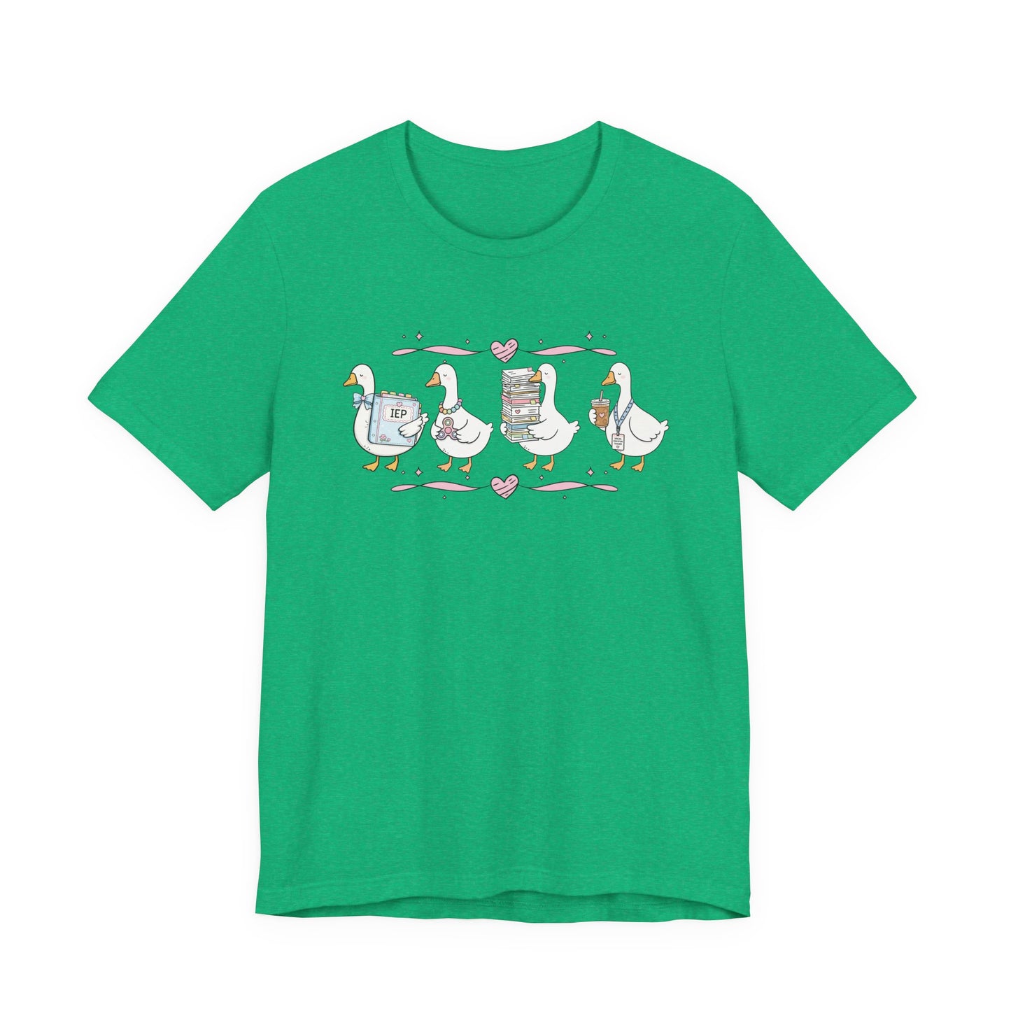 Bella + Canvas 3001 t-shirt in Heather Kelly featuring a coquette special education teacher goose design. Four white geese hold an IEP binder, sensory fidget toy, stack of paperwork, and iced coffee with a special education teacher lanyard. Pink hearts and ribbon accents add a playful touch. This cute SPED teacher shirt is perfect for special education teachers, back-to-school outfits, teacher appreciation gifts, and everyday classroom wear.