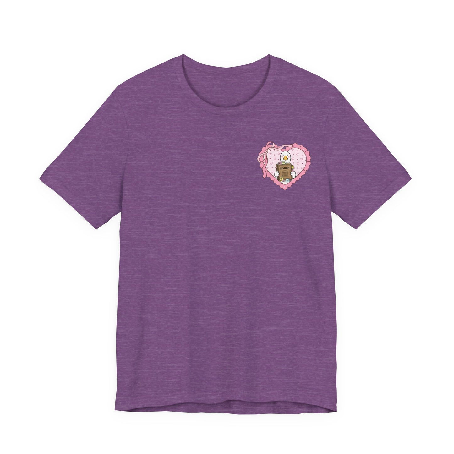 Bella + Canvas 3001 t-shirt in Heather Team Purple featuring a coquette history teacher goose heart design on the left chest. White goose holding a history book inside a pink heart with bow accents. Perfect for history teachers, social studies teachers, humanities educators, and back-to-school outfits.