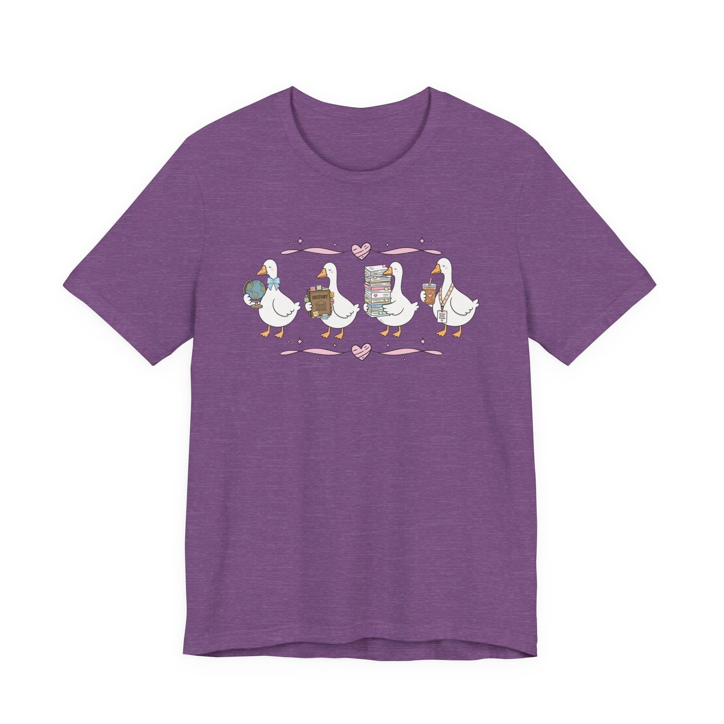 Bella + Canvas 3001 t-shirt in Heather Team Purple featuring a coquette history teacher goose design. Four white geese carry a globe, history textbook, stack of classroom papers, and iced coffee with a history teacher lanyard. Pink hearts and ribbon accents complete this cute history teacher shirt, perfect for back-to-school outfits, teacher appreciation gifts, and everyday classroom wear.