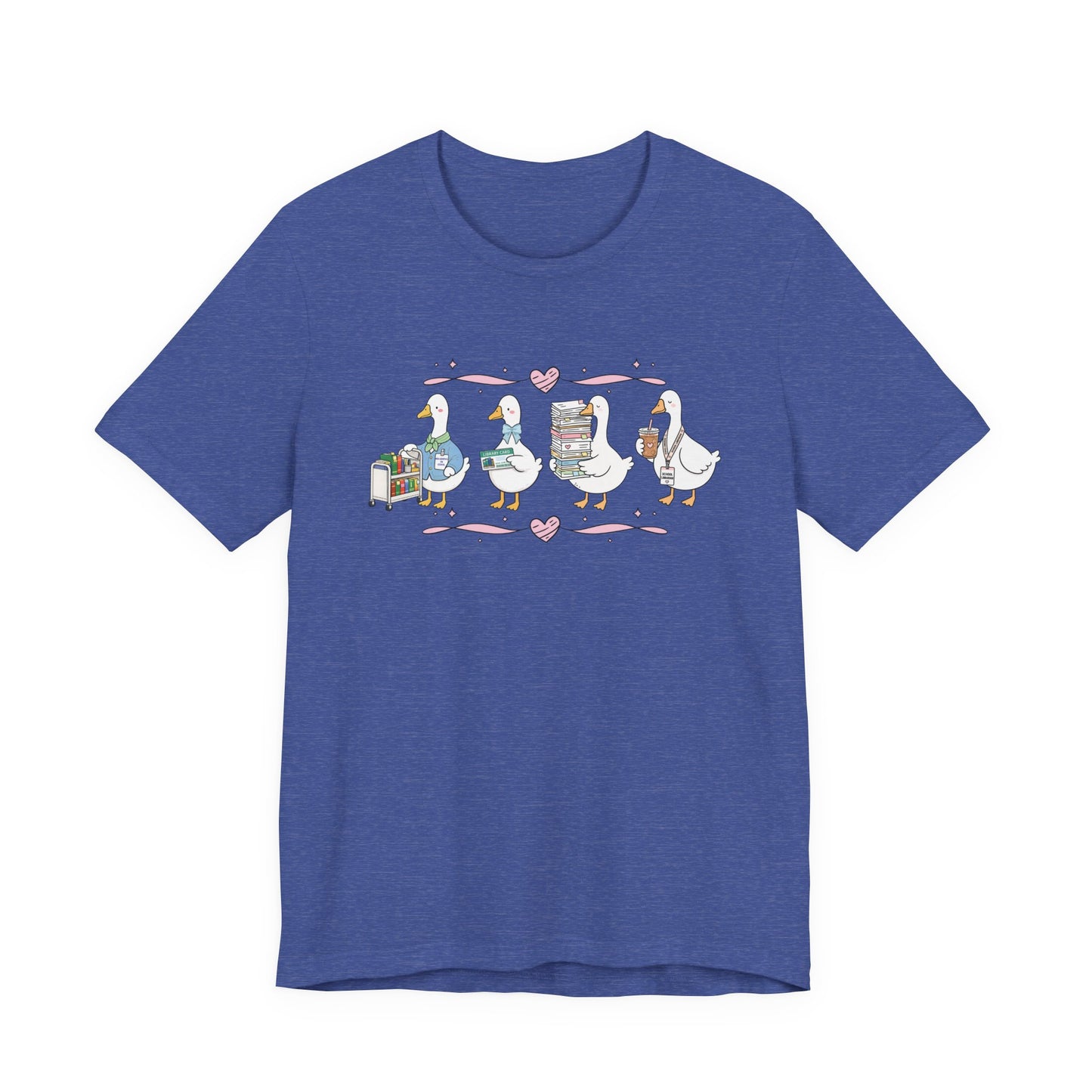 Bella + Canvas 3001 t-shirt in Heather True Royal featuring a coquette librarian goose design. Four white geese showcase a library book cart, library card, stack of books, and iced coffee with a school librarian badge. Pink hearts and ribbon accents create a fun book-loving aesthetic, making this librarian shirt perfect for school librarians, media specialists, library staff, book lovers, teacher appreciation gifts, and back-to-school outfits.