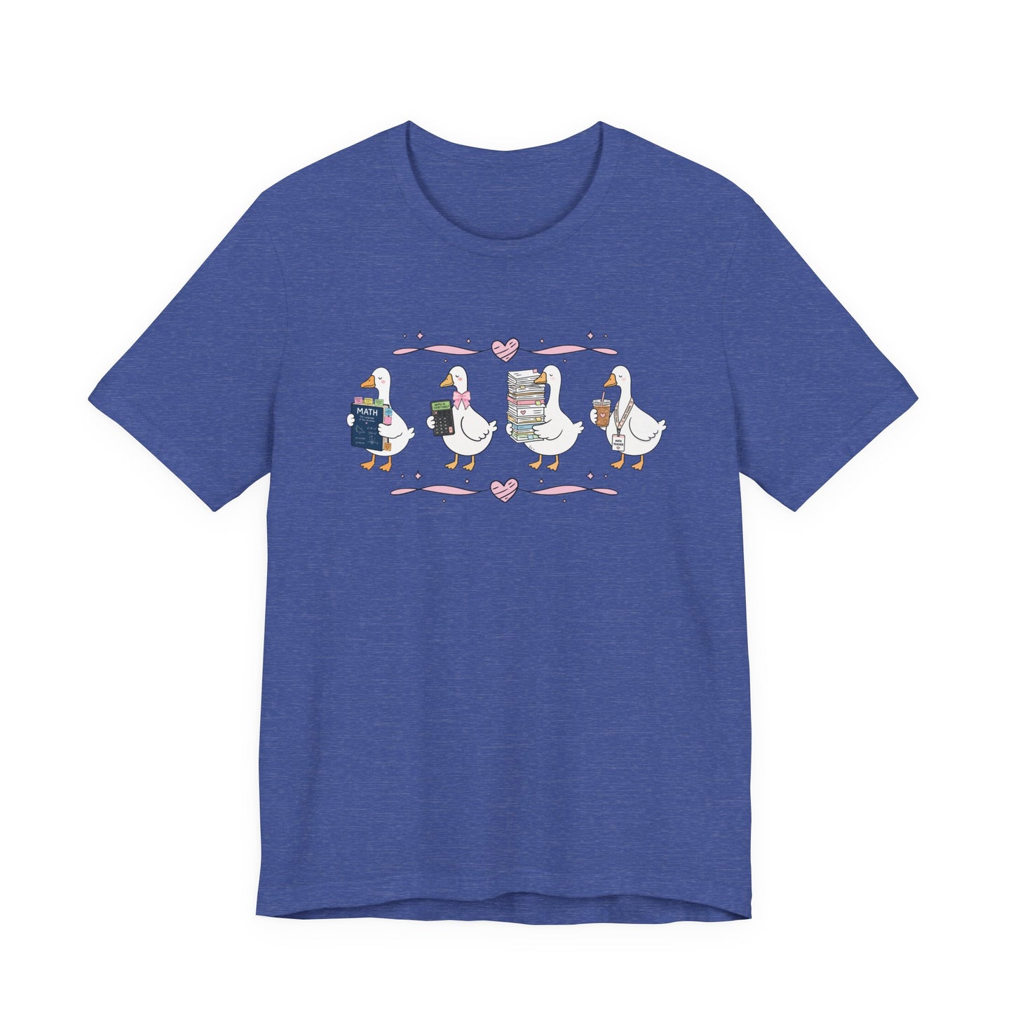 Bella + Canvas 3001 t-shirt in Heather True Royal featuring a coquette math teacher goose design. Four white geese hold a math textbook, calculator, stack of papers, and iced coffee with a teacher lanyard. Pink bows and heart accents add a charming touch. This cute math teacher shirt is perfect for back-to-school outfits, teacher appreciation gifts, and everyday classroom wear.