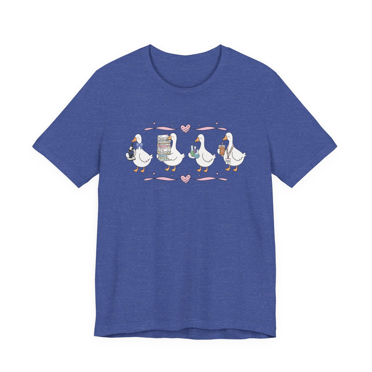 Bella + Canvas 3001 t-shirt in Heather True Royal featuring a coquette science teacher goose design. Four white geese hold a microscope, a stack of classroom papers, science beakers filled with colorful experiments, and an iced coffee with a science teacher lanyard. Pink hearts and ribbon accents add a playful touch, making this cute science teacher shirt perfect for back-to-school outfits, teacher appreciation gifts, and everyday classroom wear.