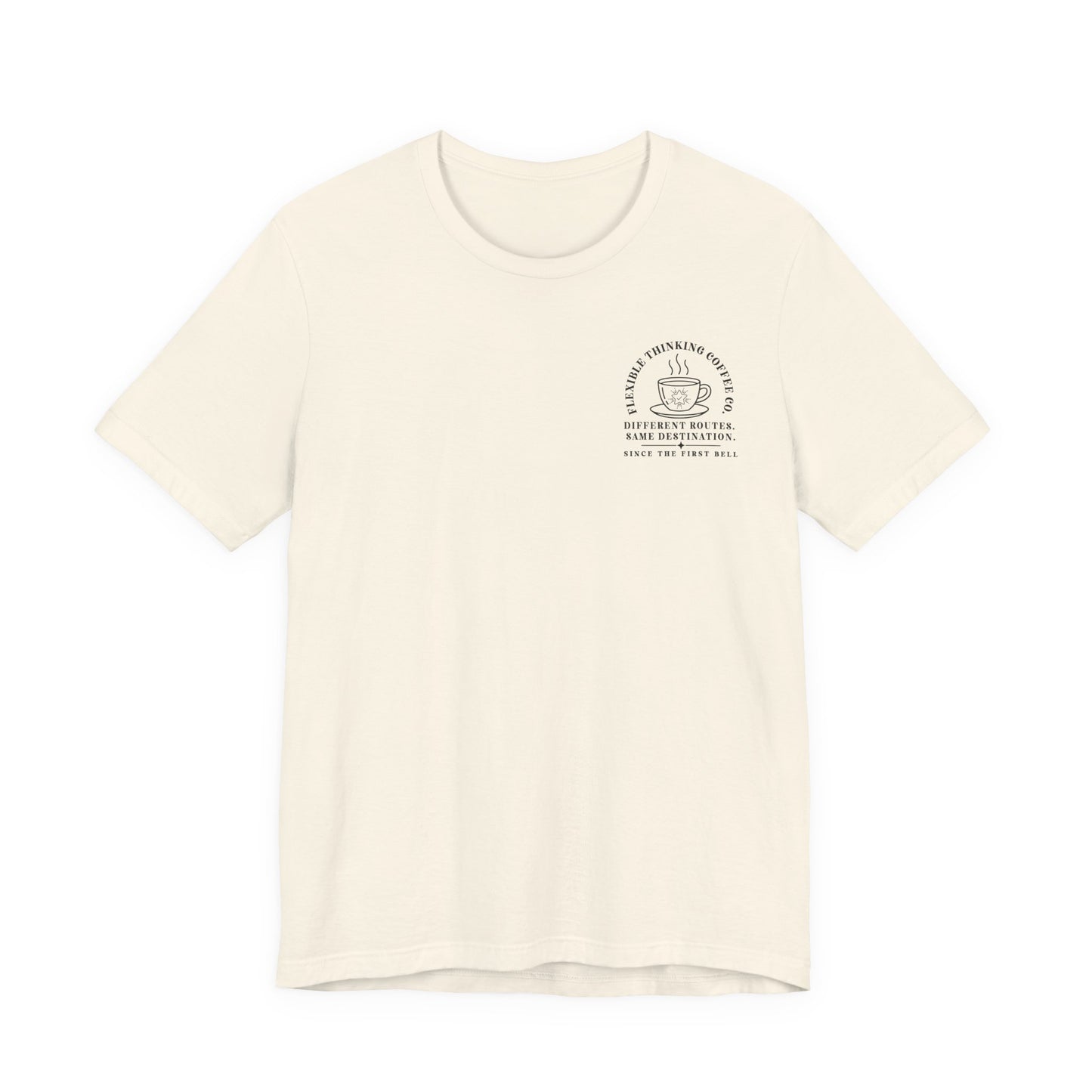 Bella + Canvas 3001 unisex t-shirt in Natural featuring a white pocket-style "Flexible Thinking Coffee Co." graphic with a steaming coffee cup and pencil icon. The design reads "Different Routes. Same Destination. Since the First Bell," making it a meaningful gift for special education teachers and intervention specialists.