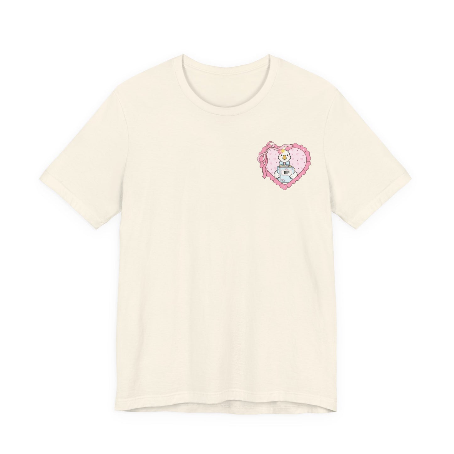 Bella + Canvas 3001 t-shirt in Natural featuring a coquette goose holding an IEP binder inside a pink heart pocket graphic. Perfect for special education teachers, support staff, and inclusive education advocates.