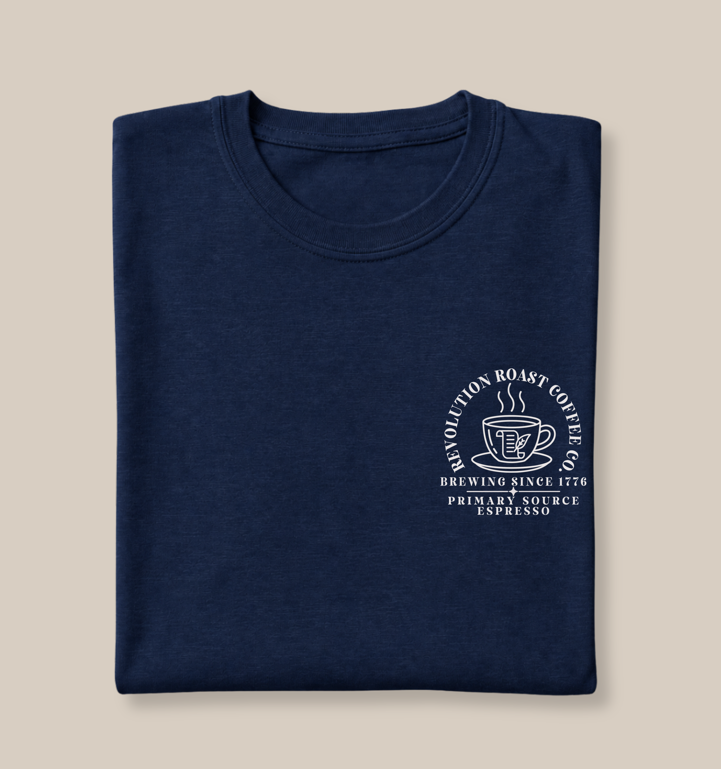Bella + Canvas 3001 unisex t-shirt in Navy featuring a white Revolution Roast Coffee Co. pocket-style graphic with a vintage coffee mug, history-inspired design, and the phrases "Brewing Since 1776" and "Primary Source Espresso." A fun history teacher shirt for coffee lovers and educators.