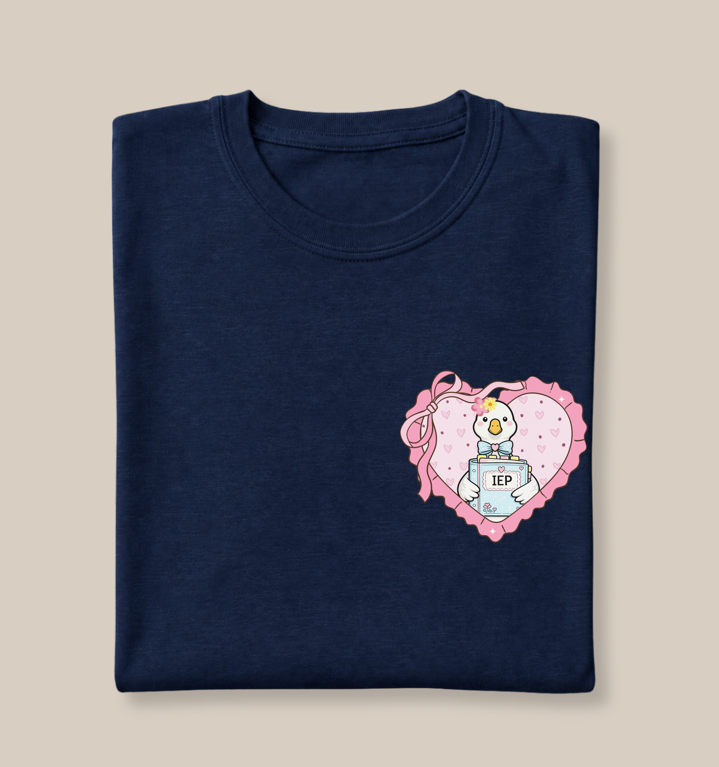 Bella + Canvas 3001 t-shirt in Navy featuring a coquette special education goose heart pocket design. The artwork shows a white goose holding an IEP binder inside a pink heart with ribbon accents and pastel details. Perfect for special education teachers, intervention teachers, resource teachers, and back-to-school educator gifts.