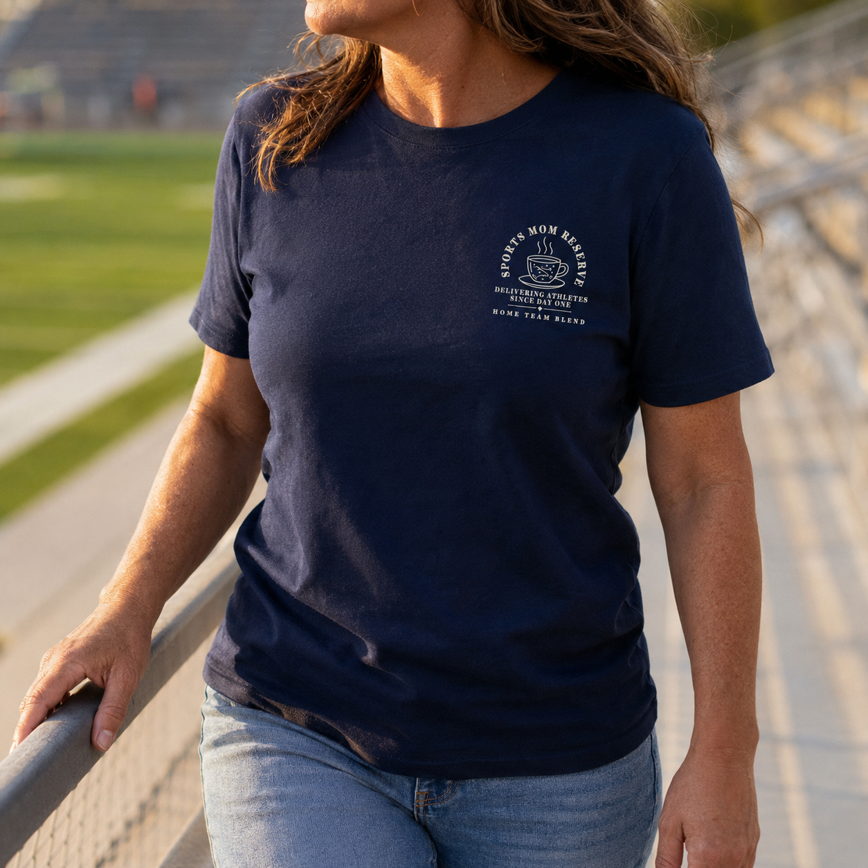 Bella + Canvas 3001 unisex t-shirt in Navy featuring a small left chest "Sports Mom Reserve" coffee cup graphic with the phrase "Delivering Athletes Since Day One. Home Team Blend." Soft casual graphic tee perfect for sports moms, game days, tournaments, school events, and cheering from the sidelines.