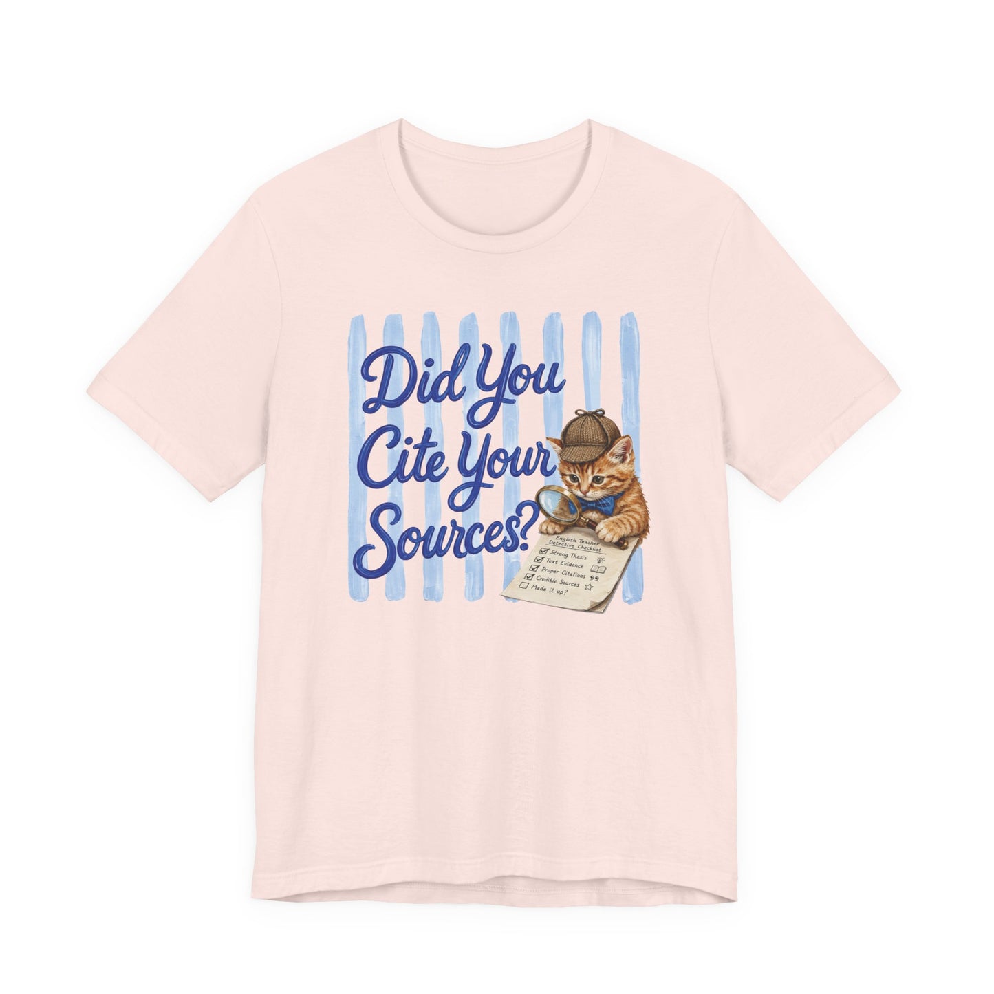 Bella + Canvas 3001 t-shirt in soft pink featuring the phrase “Did You Cite Your Sources?” in blue script with a detective kitten holding a magnifying glass and reviewing a paper checklist. Funny English teacher shirt for language arts teachers, librarians, reading specialists, literature lovers, and educators who always ask for citations.