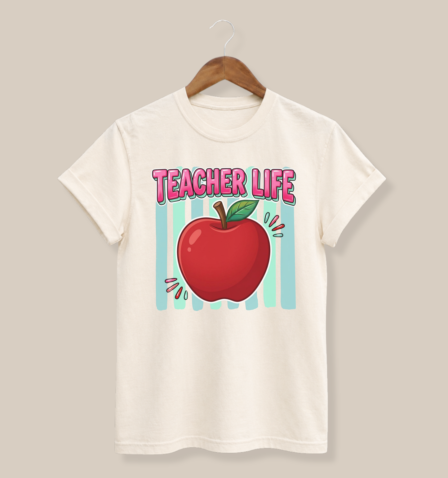 Bella + Canvas 3001 unisex t-shirt in natural featuring a colorful Teacher Life design with a bright red apple, pink retro lettering, and teal striped background. Teacher-themed graphic tee displayed on a natural cream-colored shirt hanging on a wooden hanger.