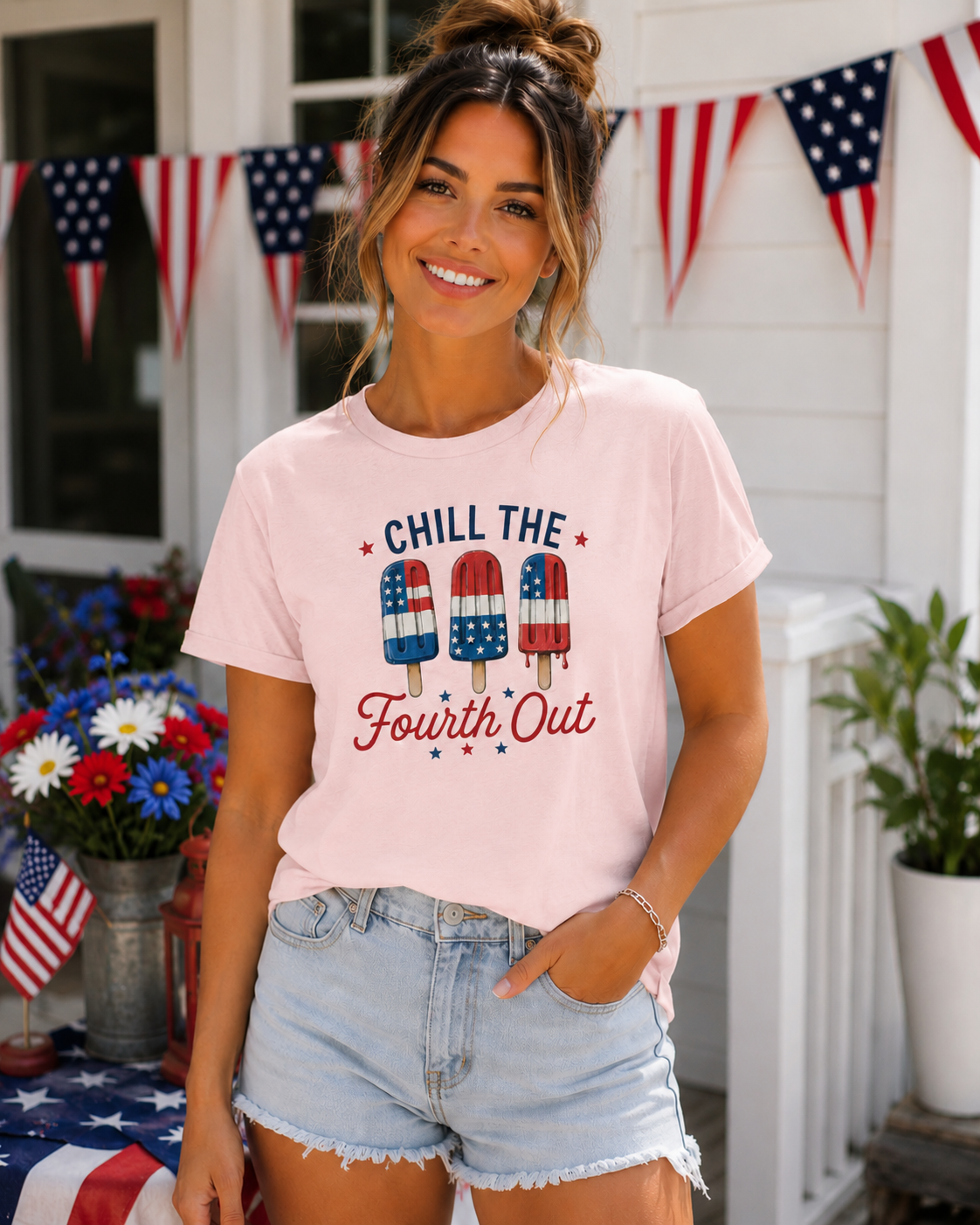 Woman wearing a light pink Bella + Canvas t-shirt featuring a patriotic “Chill the Fourth Out” graphic with red, white, and blue popsicles decorated in American flag patterns and festive Fourth of July stars.