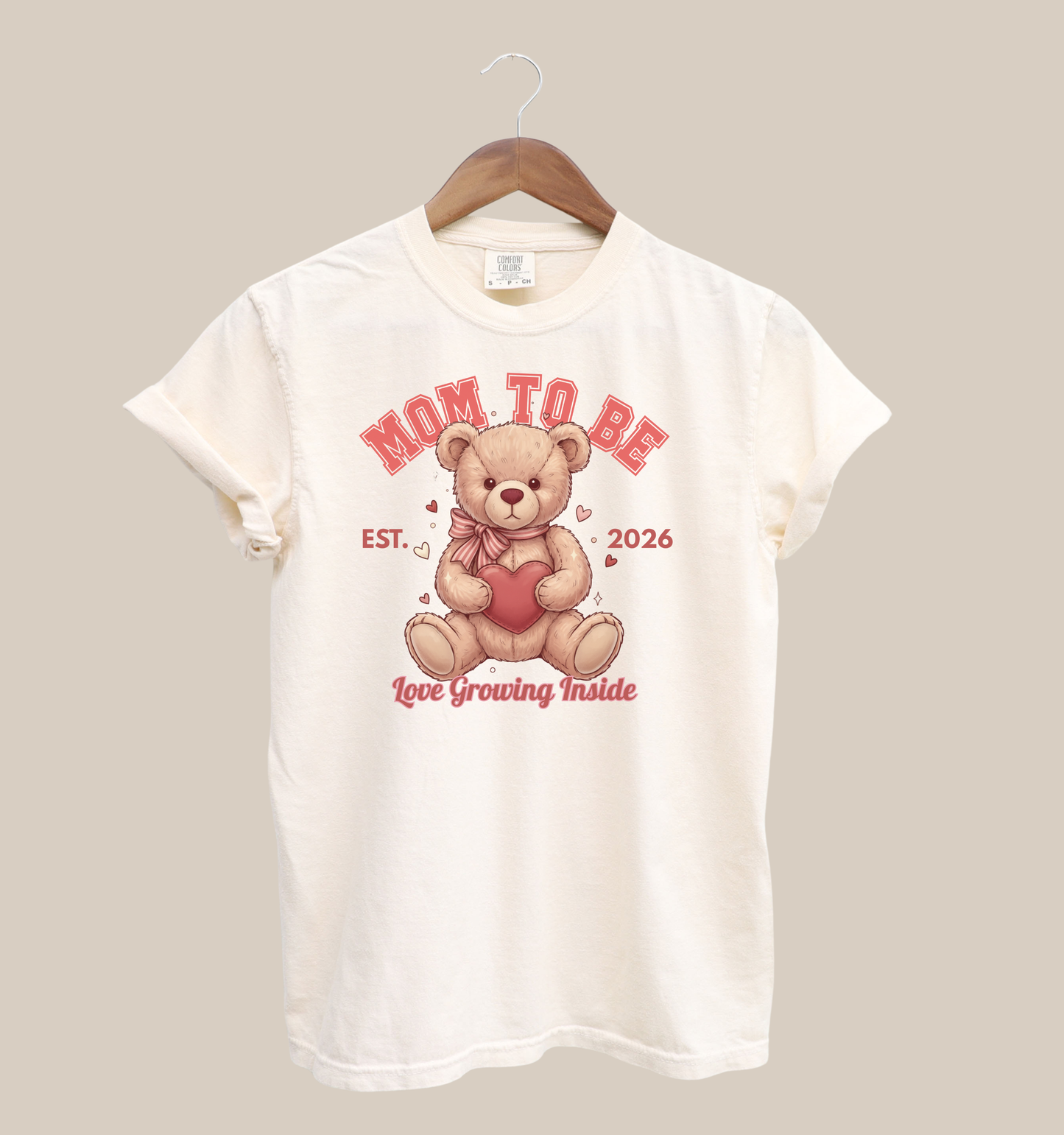 Mom To Be teddy bear Valentine shirt on cream tee, Est. 2026 design, pregnancy announcement graphic