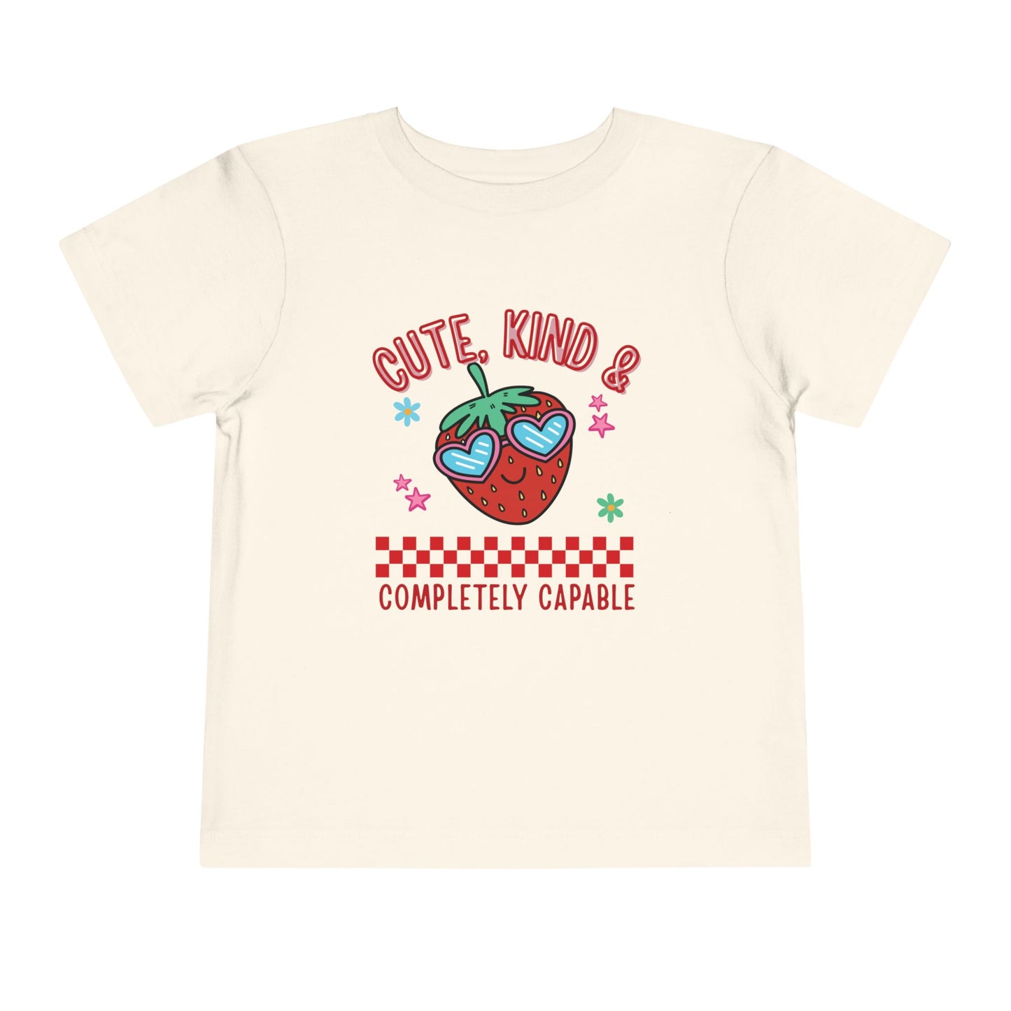 Natural toddler T-shirts featuring a smiling strawberry in heart-shaped sunglasses and the phrase “Cute, Kind & Completely Capable.”