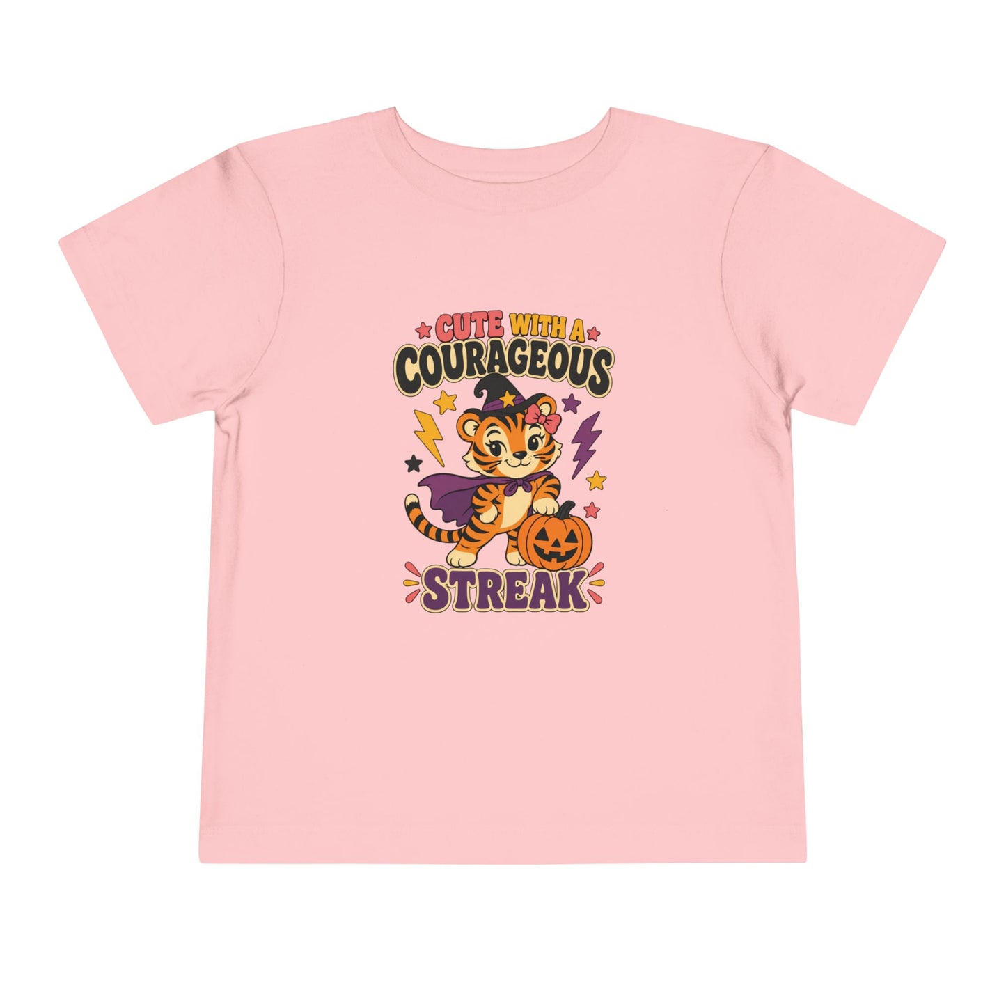 Pink color toddler T-shirt featuring a tiger dressed as a witch, a jack-o’-lantern, colorful stars, and the phrase “Cute With a Courageous Streak.”