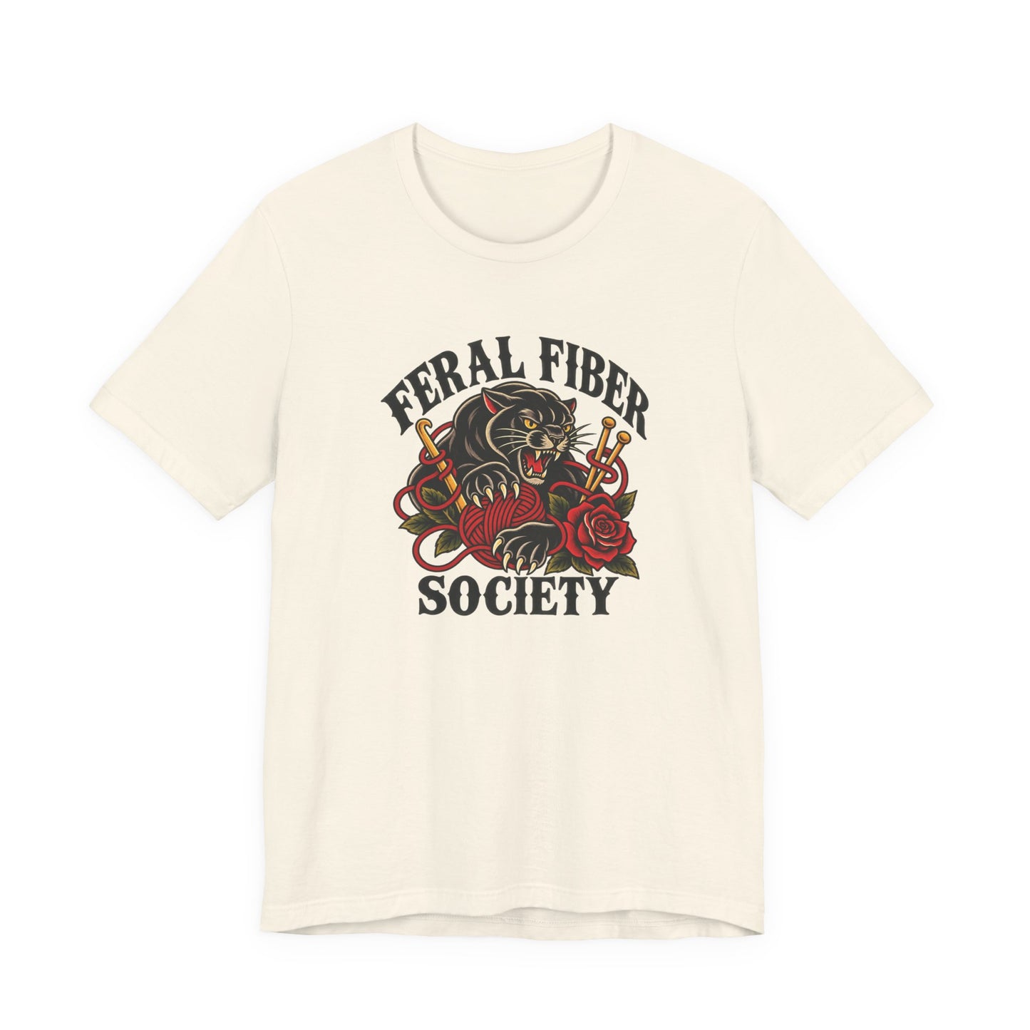 Natural classic fit tee featuring a vintage tattoo-inspired Feral Fiber Society design with a black cat, yarn, knitting needles, and red rose.