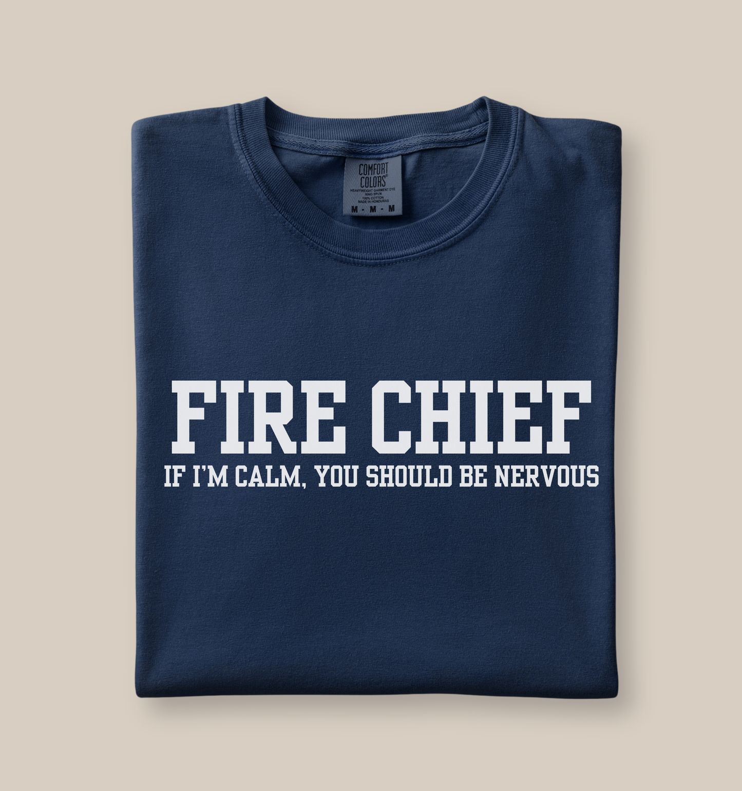 navy blue Comfort Colors t-shirt with “Fire Chief If I’m Calm You Should Be Nervous” graphic in bold white lettering