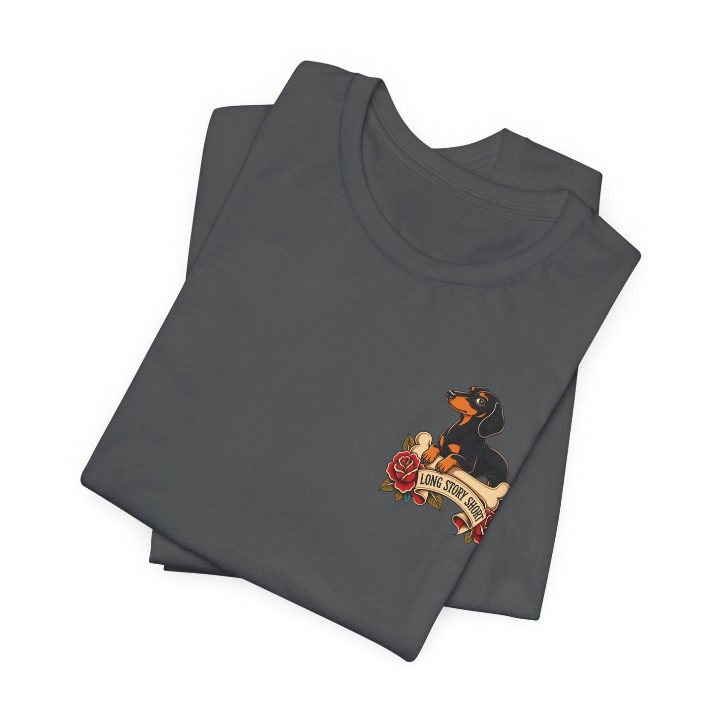 Asphalt grey adult T-shirt featuring a black and tan dachshund, floral accents, and the humorous phrase “Long Story Short.”
