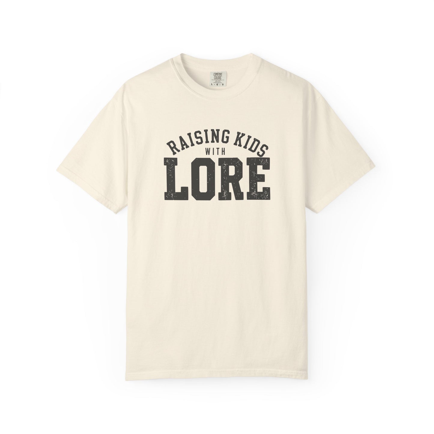 Ivory garment-dyed adult T-shirt featuring bold charcoal collegiate lettering with the witty phrase “Raising Kids With Lore.”