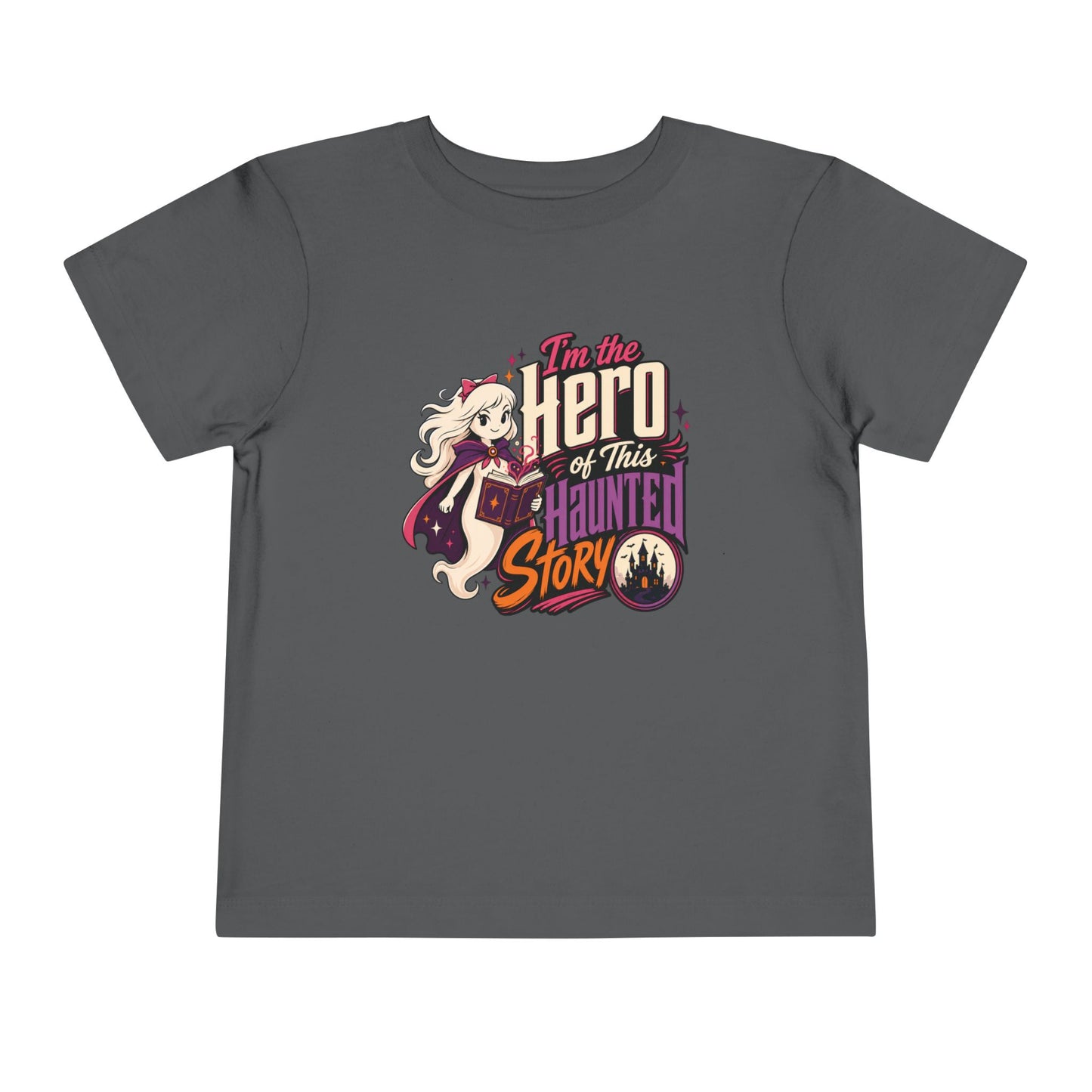 Asphalt grey toddler T-shirt featuring a magical ghost hero, open spell book, haunted castle, and bold Halloween lettering.
