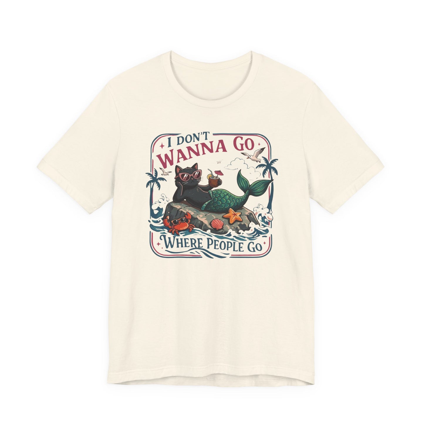 Bella + Canvas 3001 t-shirt in natural featuring a funny introvert-inspired black cat mermaid graphic wearing sunglasses with tropical beach artwork and the phrase “I Don’t Wanna Go Where People Go.”