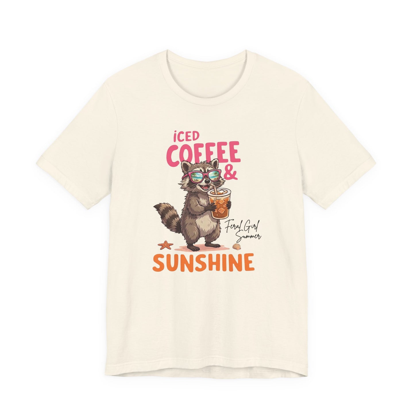 Bella + Canvas 3001 t-shirt in natural featuring a raccoon wearing sunglasses and holding an iced coffee with the phrase “Iced Coffee & Sunshine” in colorful summer-inspired lettering.