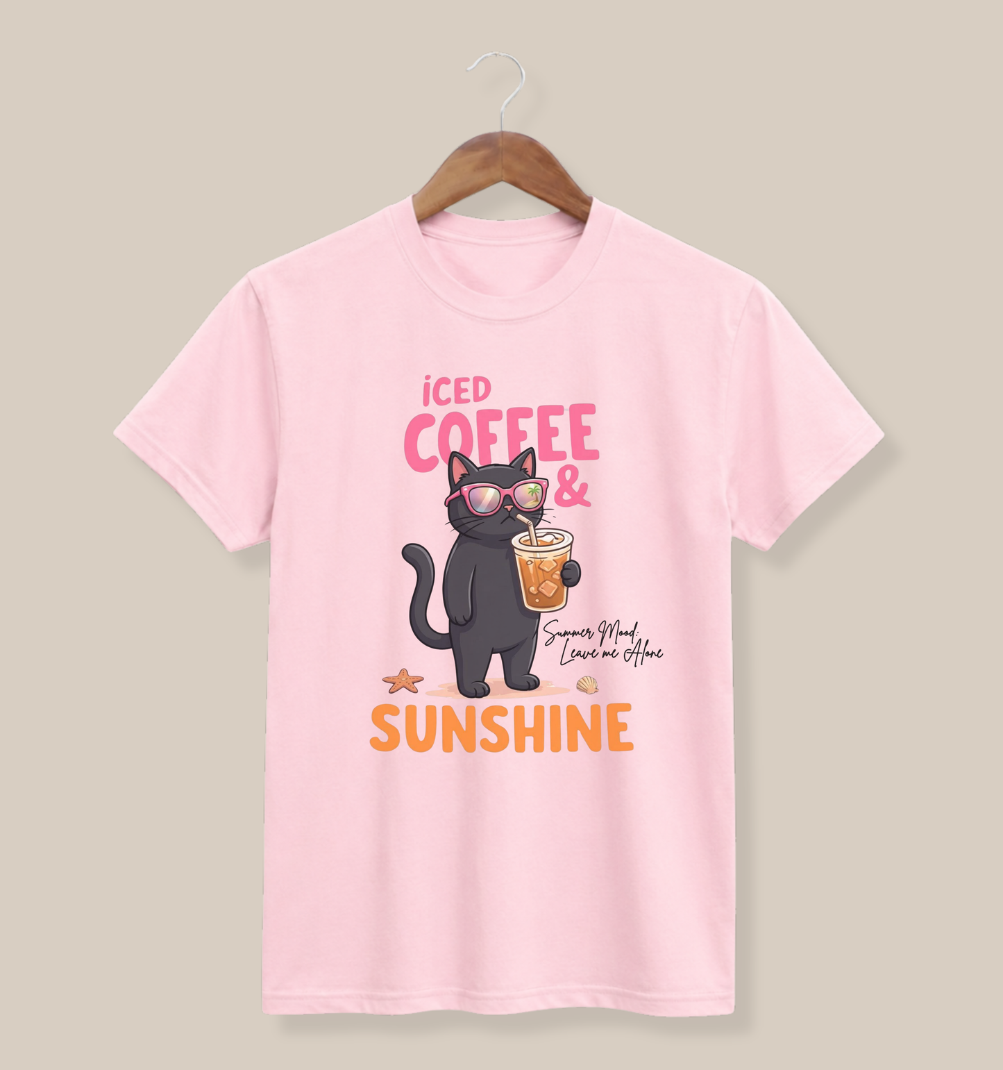 Bella + Canvas 3001 t-shirt in soft pink featuring a black cat wearing sunglasses and holding an iced coffee with the phrase “Iced Coffee & Sunshine” and a playful summer-inspired design.