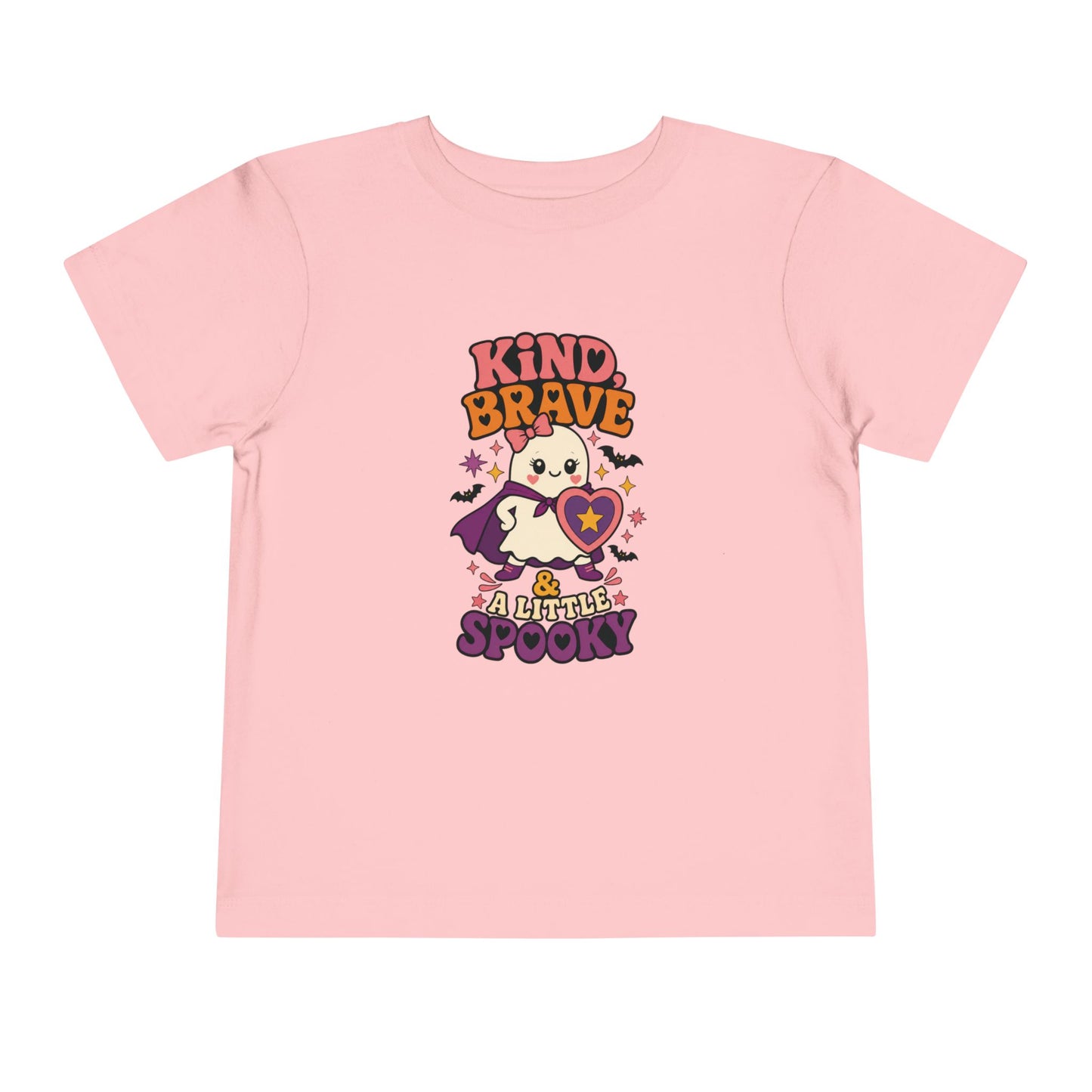 Pink color toddler T-shirt featuring a brave ghost in a purple cape holding a heart shield, surrounded by colorful stars and bats.