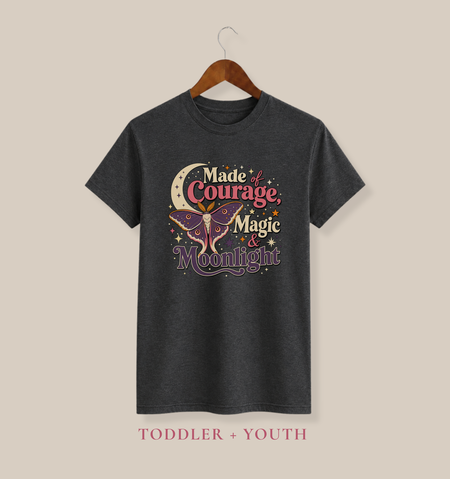 Dark grey heather youth T-shirt featuring a colorful luna moth, crescent moon, celestial stars, and bold magical lettering.