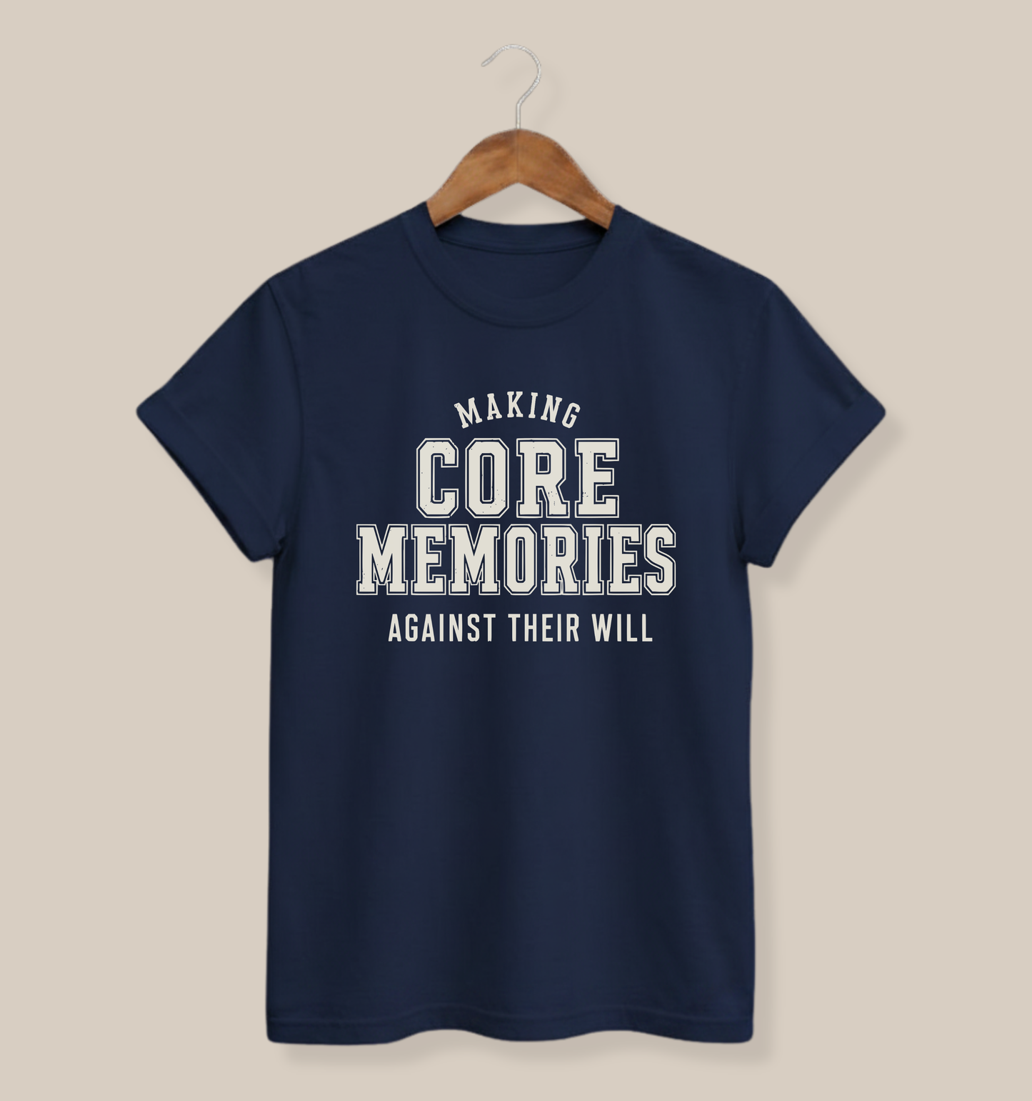 Navy adult T-shirt featuring a lightly distressed cream varsity design and the funny family phrase “Making Core Memories Against Their Will.”