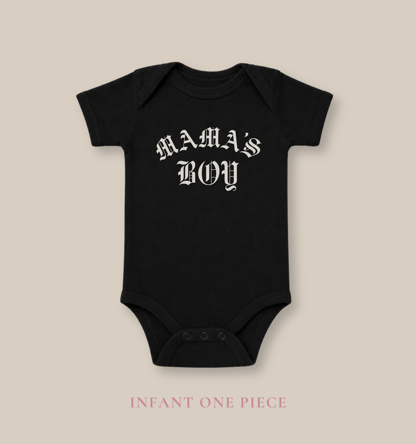 Black Bella + Canvas 100B infant one piece featuring a white “Mama’s Boy” gothic-style graphic for trendy baby outfits, modern streetwear-inspired baby fashion, and baby shower gifts.