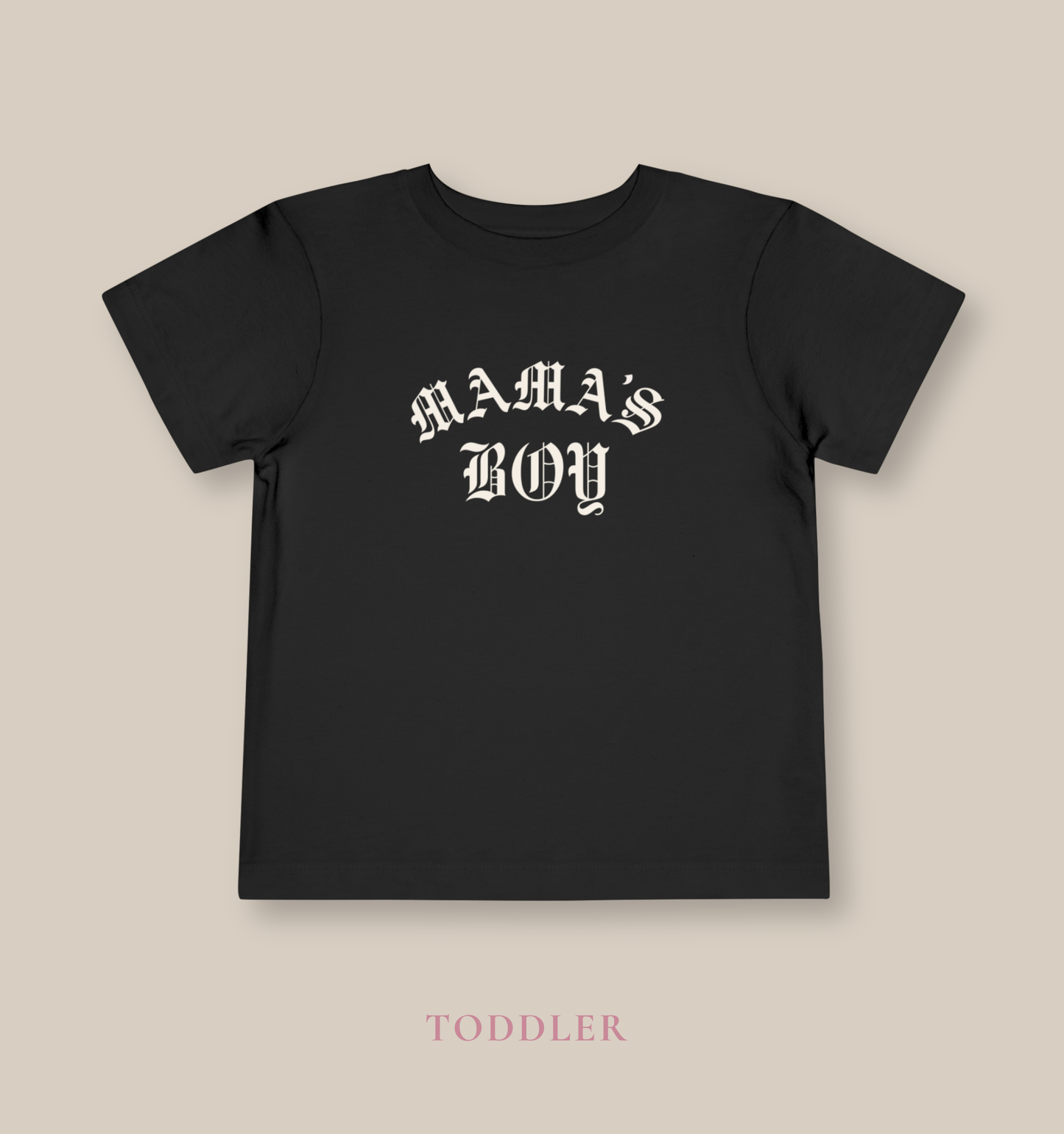 Black Bella + Canvas toddler tee featuring a white “Mama’s Boy” gothic-style graphic for trendy toddler outfits, edgy kids streetwear fashion, and stylish matching family looks.