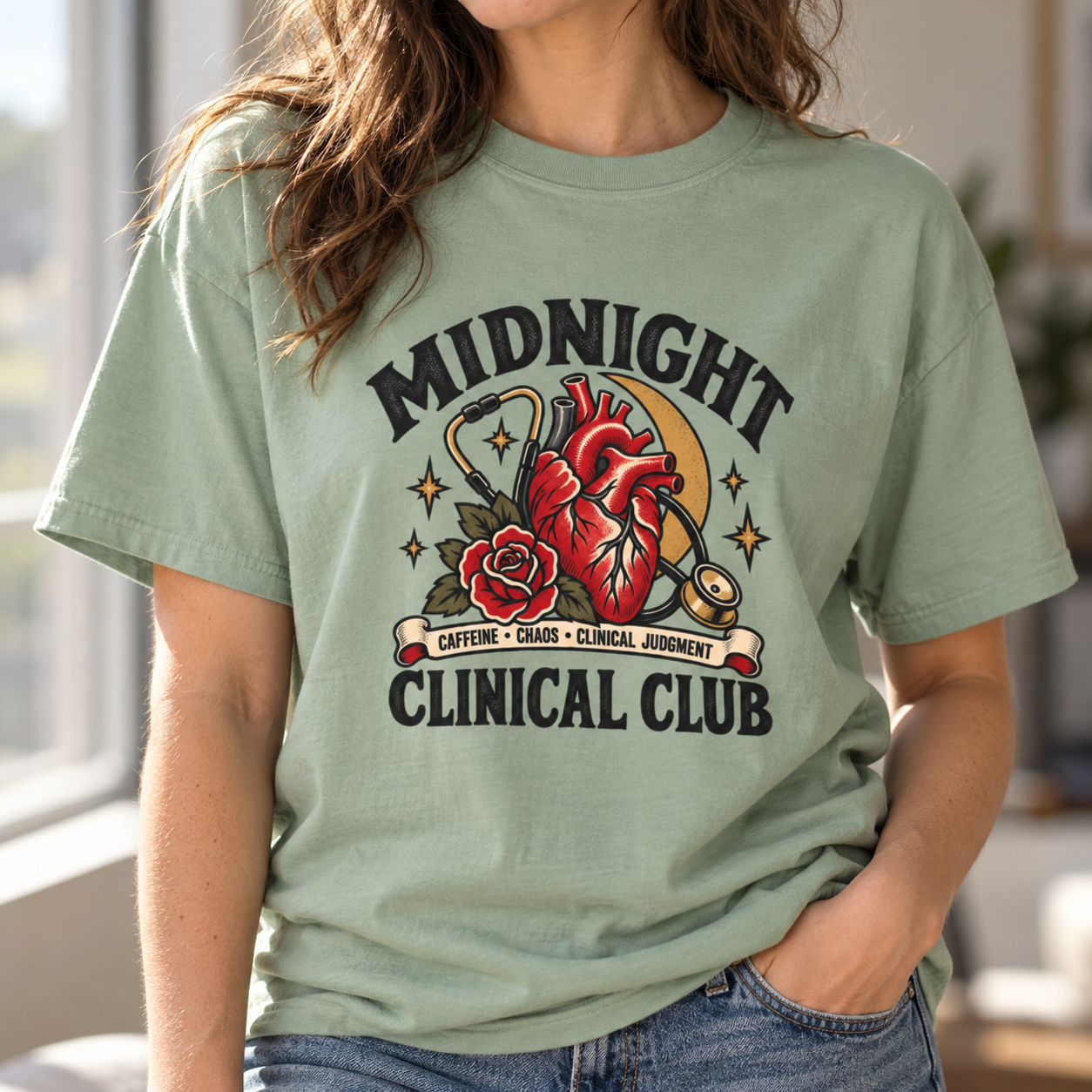 Bay vintage feel tee featuring a Midnight Clinical Club design with an anatomical heart, stethoscope, crescent moon, stars, and red rose artwork.