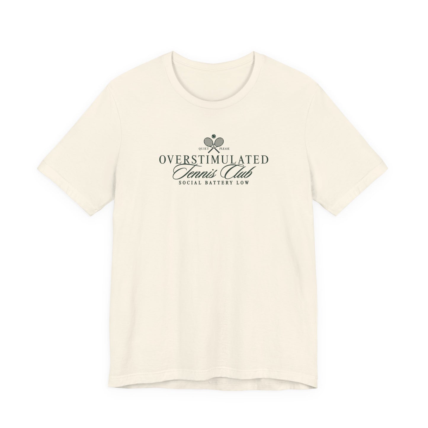 Natural Bella + Canvas 3001 t-shirt featuring a minimalist “Overstimulated Tennis Club” graphic with crossed tennis rackets and the phrase “Social Battery Low” in dark green lettering.