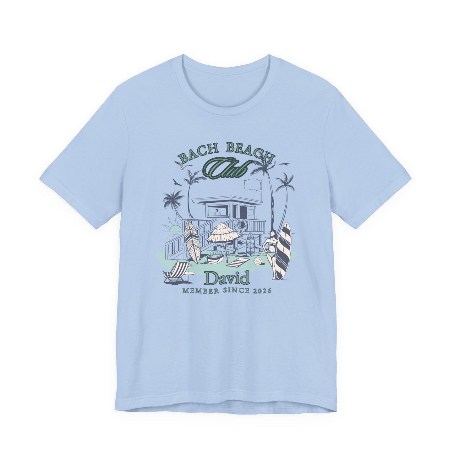 Personalized Bella + Canvas 3001 t-shirt in baby blue featuring a retro beach bachelor party design with palm trees, surfboards, beach house artwork, custom name text, and “Bach Beach Club Member Since 2026” wording in coastal green and blue lettering.